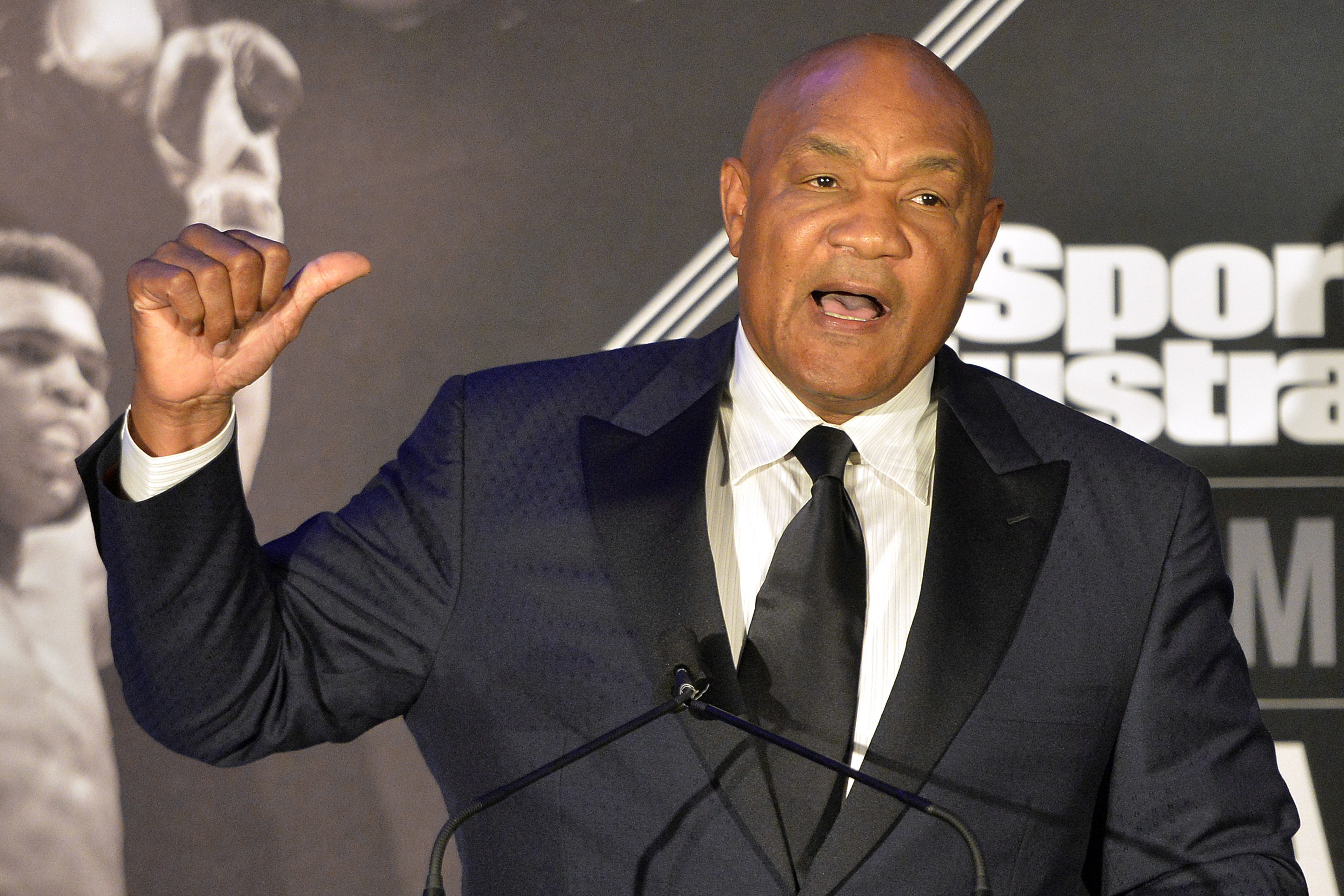 FILE - Former heavyweight boxing champion George Foreman tells a story to the audience at the Sports Illustrated Legacy Awards, Oct. 1, 2015, in Louisville, Ky.