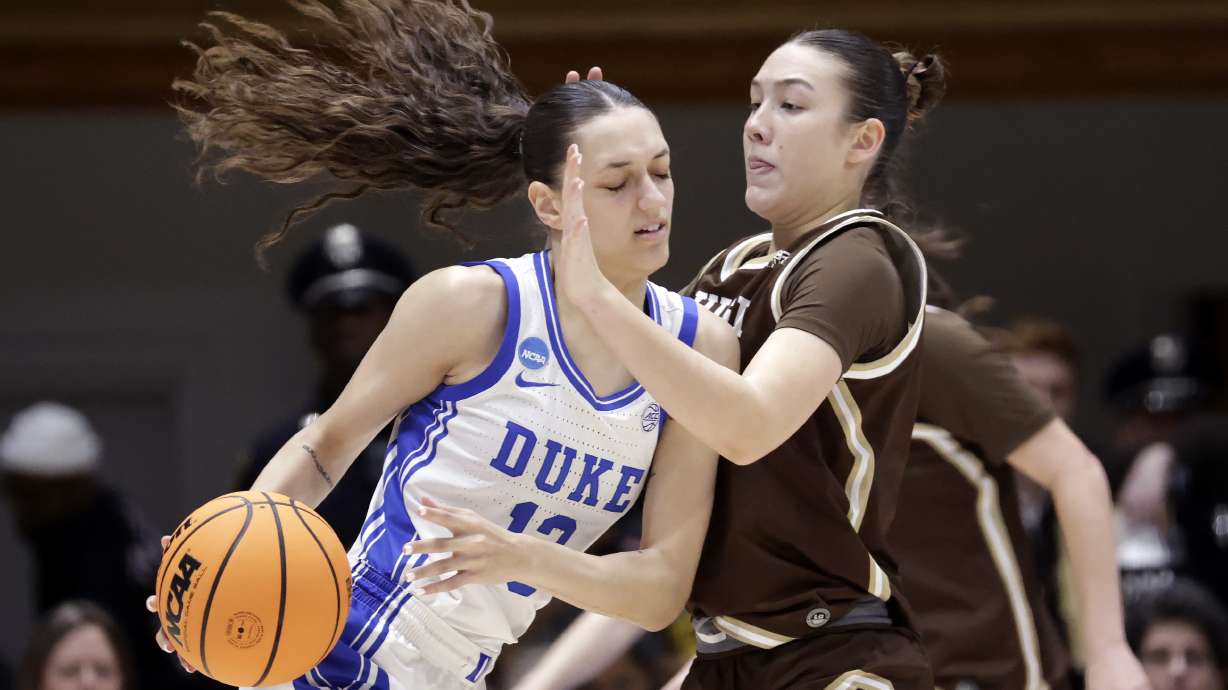 Duke forward Jordan Wood, left, drives against Lehigh guard Remi Sisselman, right, during the first half in the first round of the NCAA college basketball tournament Friday, March 21, 2025, in Durham N.C.