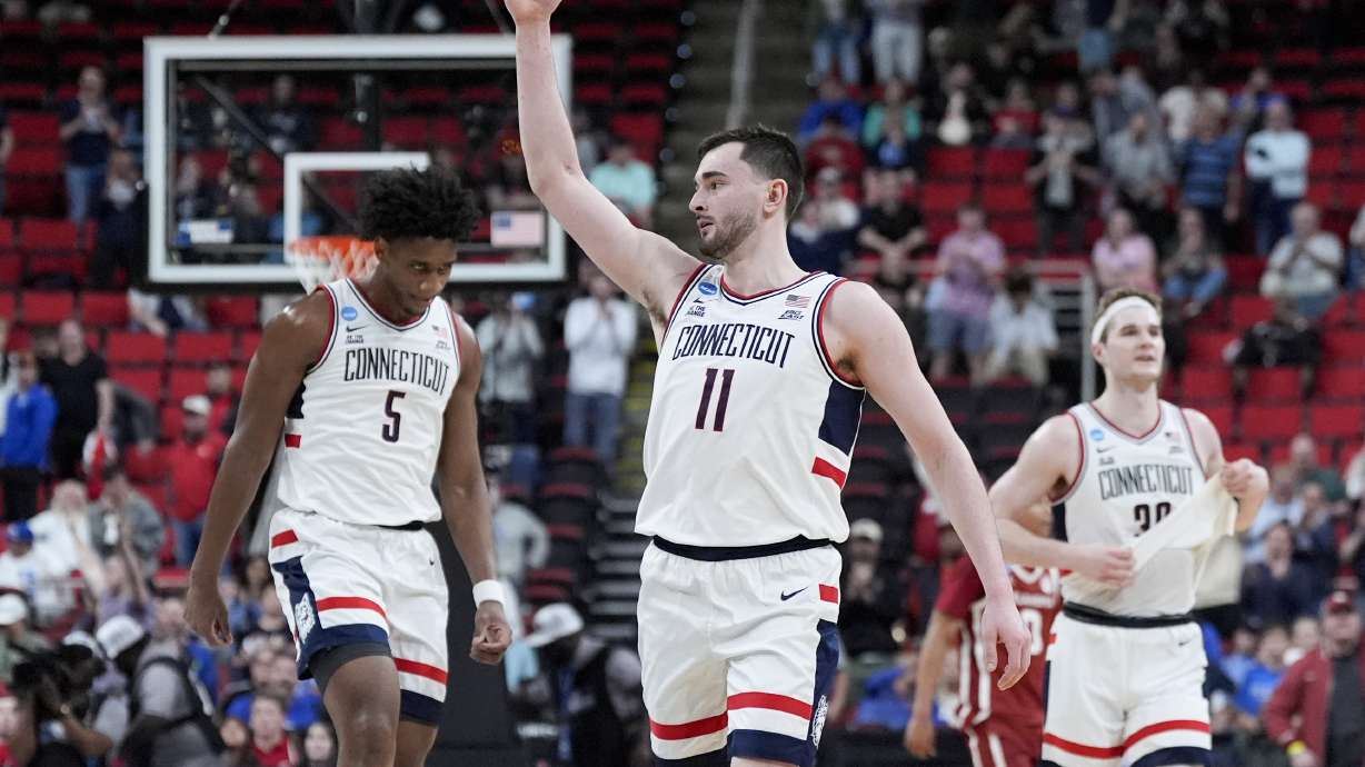 UConn forward Alex Karaban celebrates after their win against Oklahoma in the first round of the NCAA college basketball tournament, Friday, March 21, 2025, in Raleigh, N.C.