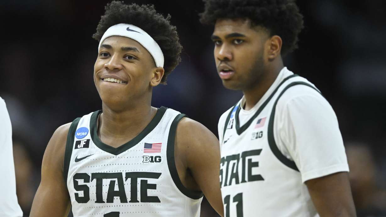 Michigan State guards Jeremy Fears Jr. (1) and Jase Richardson (11) react in the second half against Bryant in the first round of the NCAA college basketball tournament, Friday, March 21, 2025, in Cleveland.