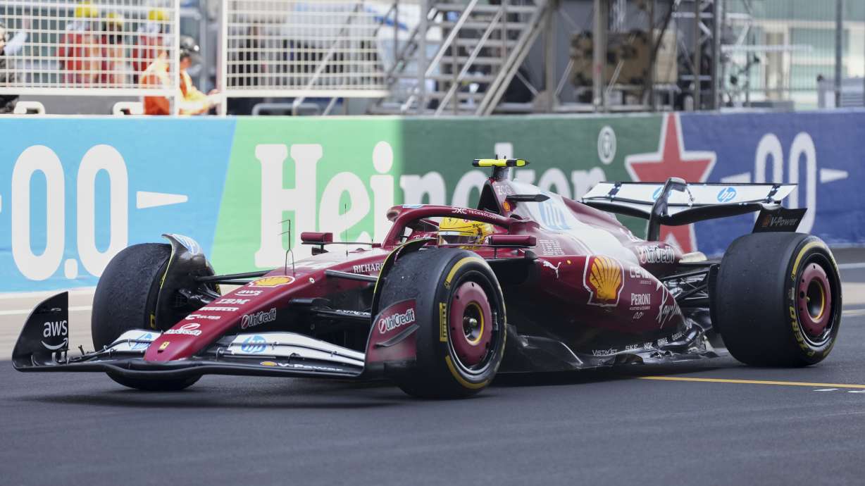 Ferrari driver Lewis Hamilton of Britain steers his car during the sprint race ahead of the Chinese Formula One Grand Prix at the Shanghai International Circuit, Shanghai, Saturday, March 22, 2025.