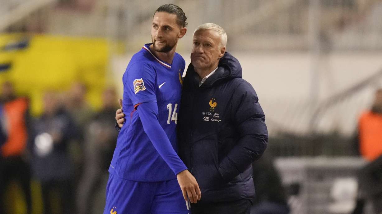 France's coach Didier Deschamps hugs France's Adrien Rabiot as he leaves the pitch after being substituted during the UEFA Nations League quarterfinal soccer match between Croatia and France, at the Poljud stadium in Split, Croatia, Thursday, March 20, 2025.