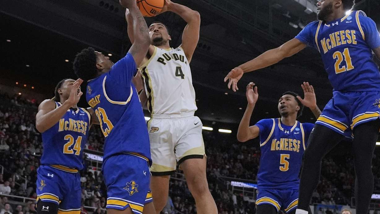 Purdue forward Trey Kaufman-Renn (4) is surrounded by McNeese State players on a shot during the second half in the second round of the NCAA college basketball tournament, Saturday, March 22, 2025, in Providence, R.I.