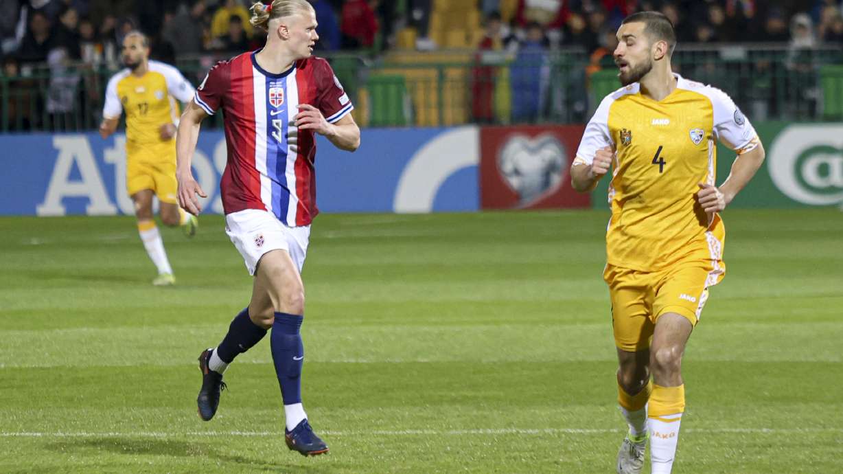 Norway's Erling Haaland follows the ball with Moldova's Vladislav Baboglo during a Group I, World Cup qualifier soccer match between Moldova and Norway at the Zimbru stadium in Chisinau, Moldova, Saturday, March 22, 2025.