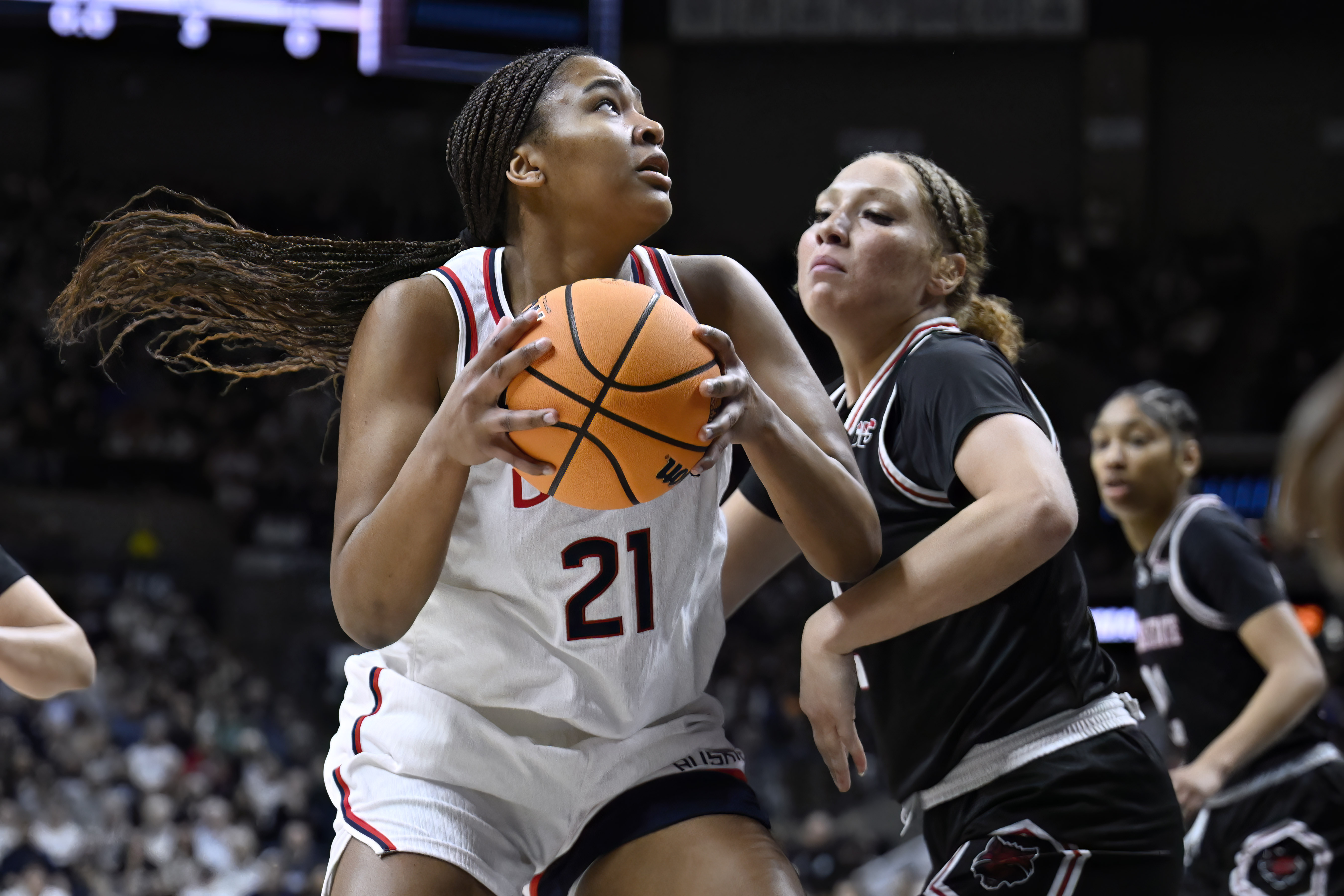 UConn forward Sarah Strong (21) is guarded by Arkansas State guard Wynter Rogers during the first half in the first round of the NCAA college basketball tournament, Saturday, March 22, 2025, in Storrs, Conn.