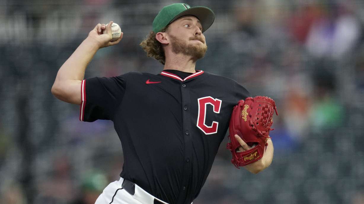 Cleveland Guardians starting pitcher Tanner Bibee throws against the Cincinnati Reds during the second inning of a spring training baseball game Monday, March 17, 2025, in Goodyear, Ariz.