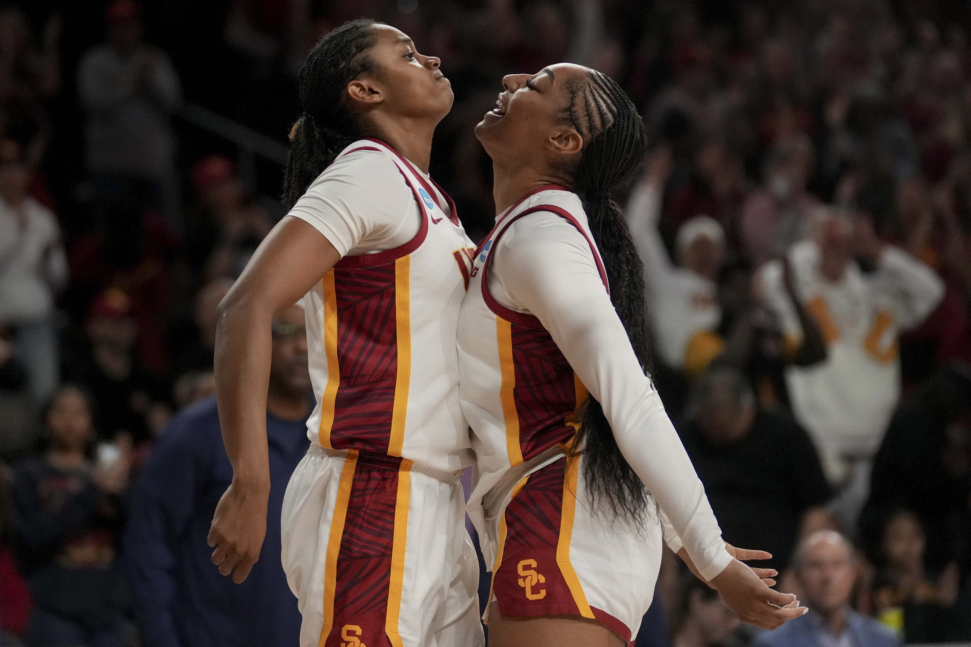 Southern California center Rayah Marshall, left, and guard Kennedy Smith celebrate during the first half of a game against UNC Greensboro in the first round of the NCAA college basketball tournament Saturday, March 22, 2025, in Los Angeles.