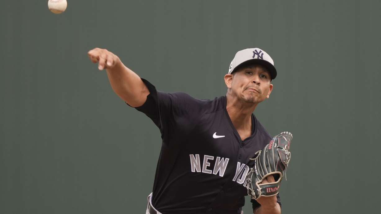 New York Yankees starting pitcher Carlos Carrasco delivers in the first inning of a spring training baseball game against the Minnesota Twins in Fort Myers, Fla., Tuesday, Feb. 25, 2025.