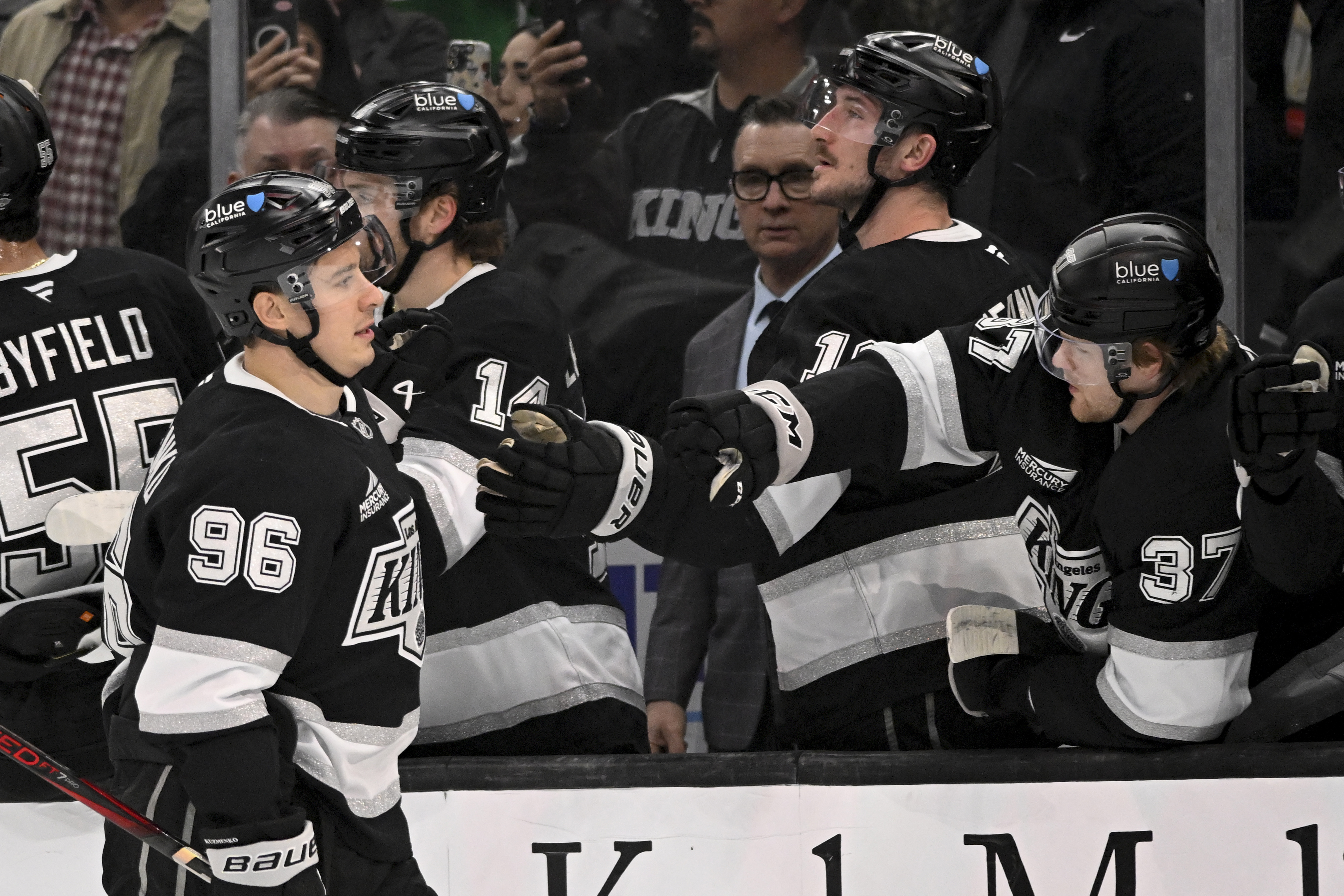 Los Angeles Kings' Andrei Kuzmenko (96) celebrates with teammates after scoring against the Carolina Hurricanes during the first period of an NHL hockey game in Los Angeles, Saturday, March 22, 2025.