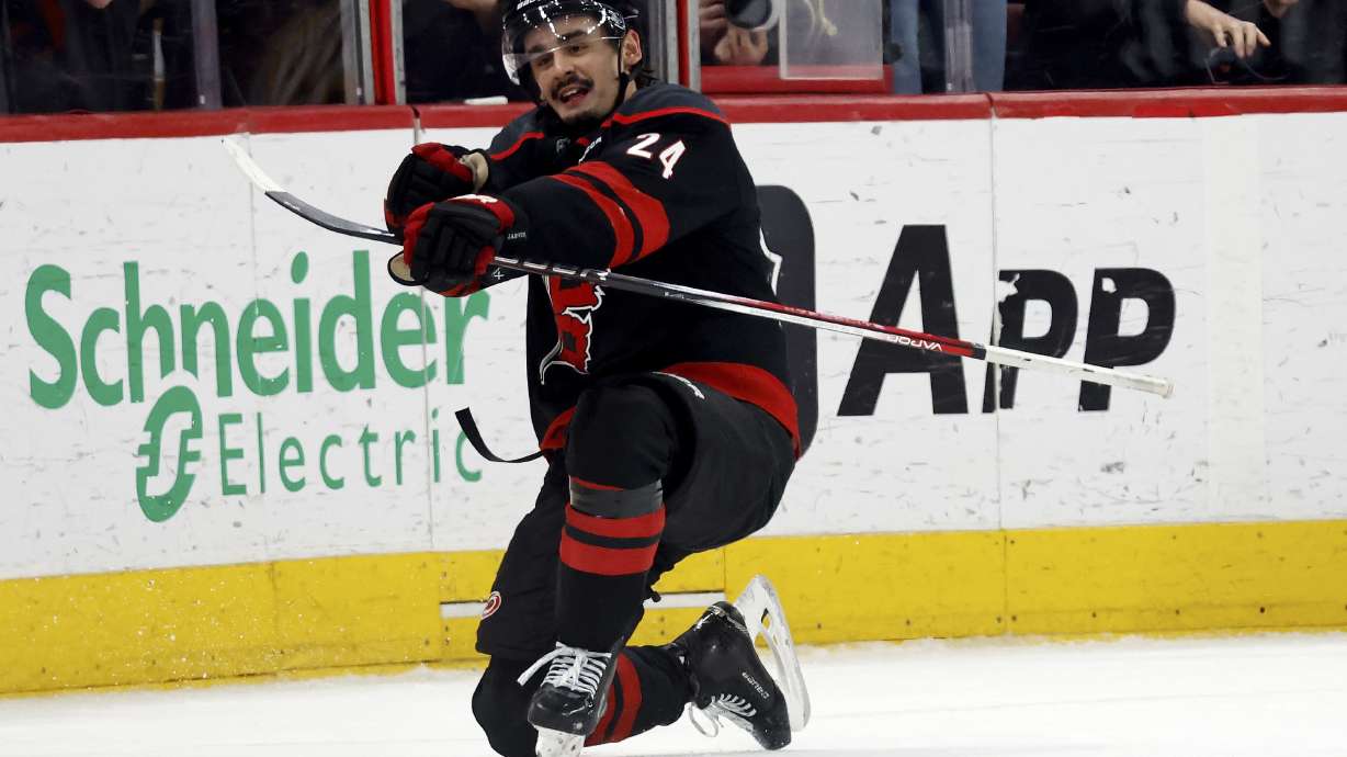 Carolina Hurricanes' Seth Jarvis (24) celebrates his game winning goal against the Boston Bruins during the third period of an NHL hockey game in Raleigh, N.C., Thursday, March 6, 2025.