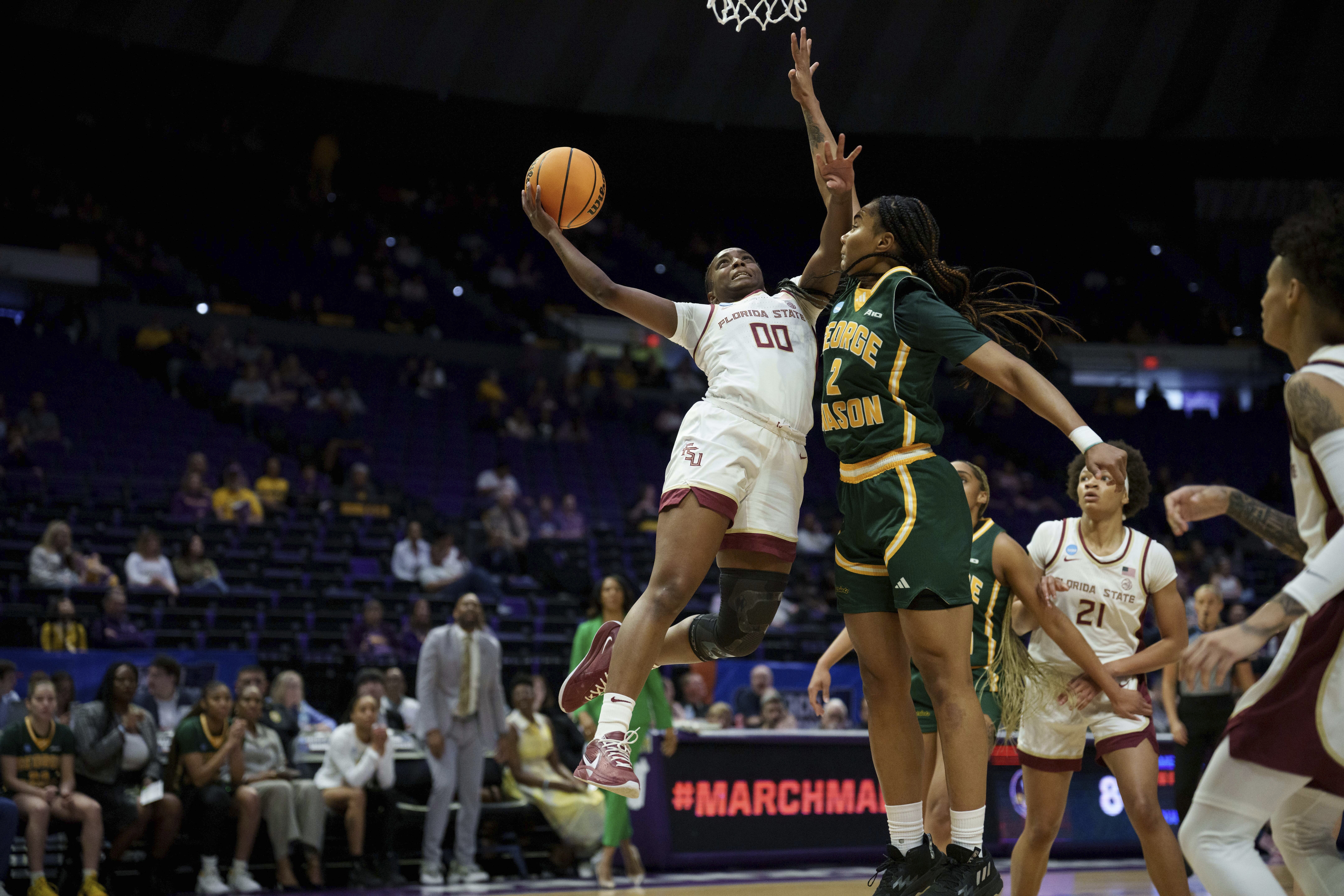 Florida State guard Ta'Niya Latson (00) shoots against George Mason forward Zahirah Walton (2) during the first half in the first round of the NCAA college basketball tournament, Saturday, March 22, 2025, in Baton Rouge, La.