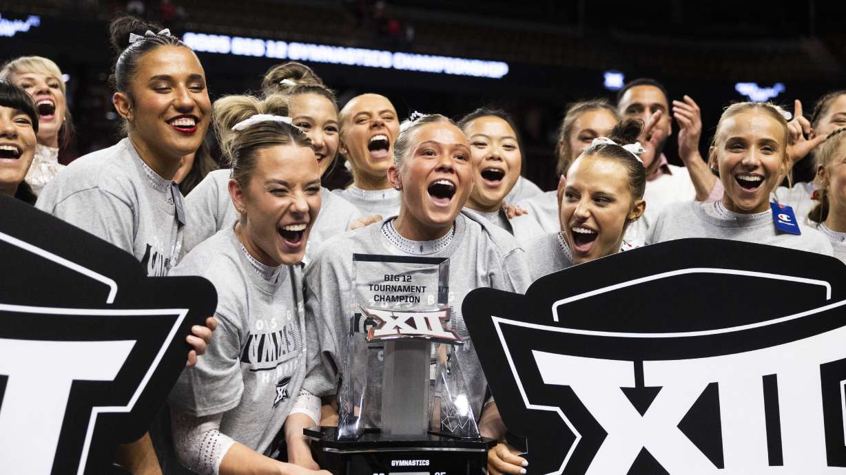 The Utah Red Rocks celebrate after winning the Big 12 gymnastics championship at the Maverik Center in Salt Lake City on Saturday, March 22, 2025.