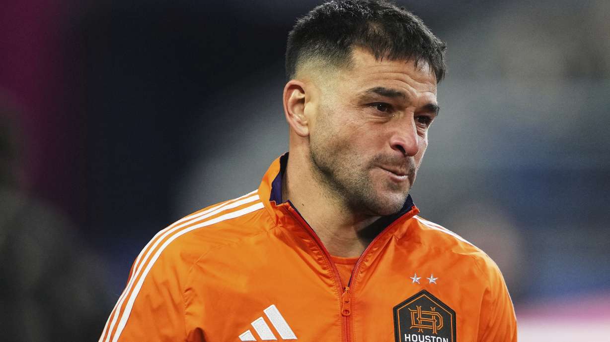 Houston Dynamo midfielder Nicolás Lodeiro becomes emotional after the national anthem before facing his former team, the Seattle Sounders, in an MLS soccer match Saturday, March 22, 2025, in Seattle.