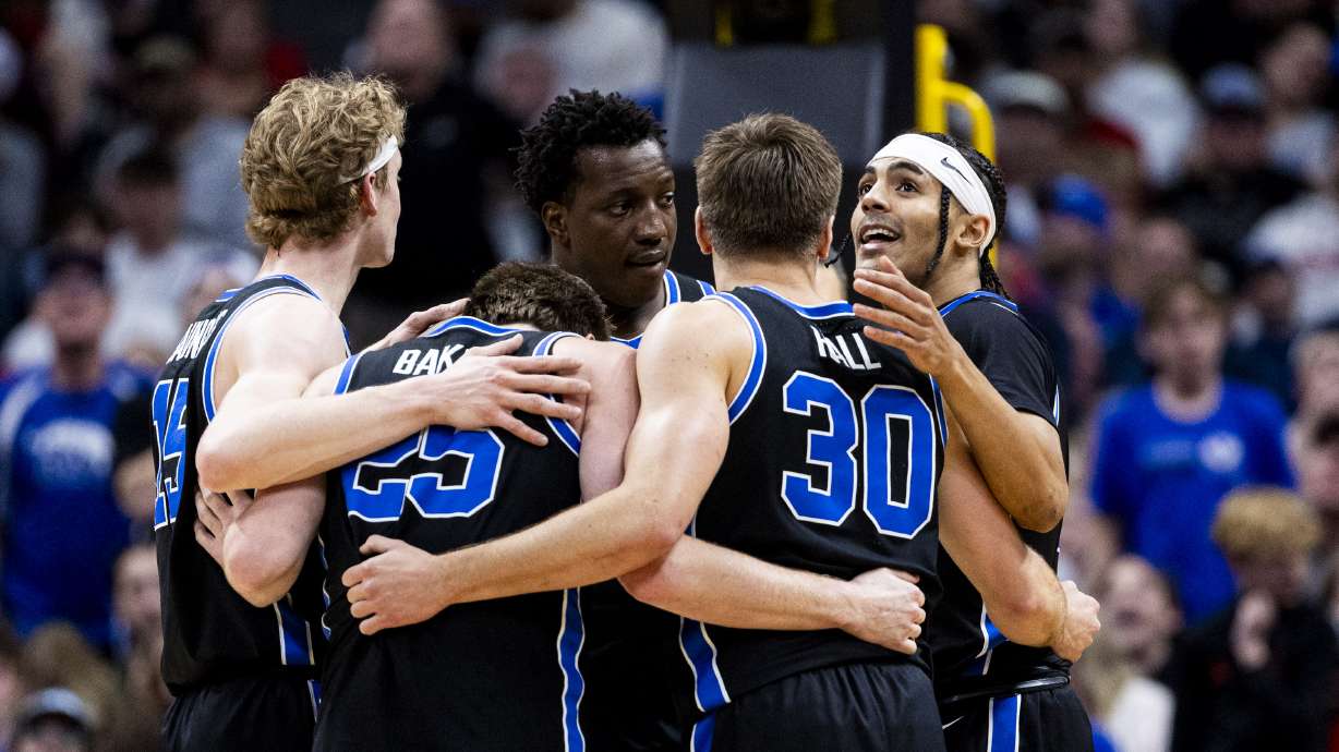 BYU Cougars guard Trey Stewart (1) looks up as he and his teammates huddle during a second-round college basketball game in the NCAA Tournament against the Wisconsin Badgers held at Ball Arena in Denver, Colo., on Saturday, March 22, 2025.