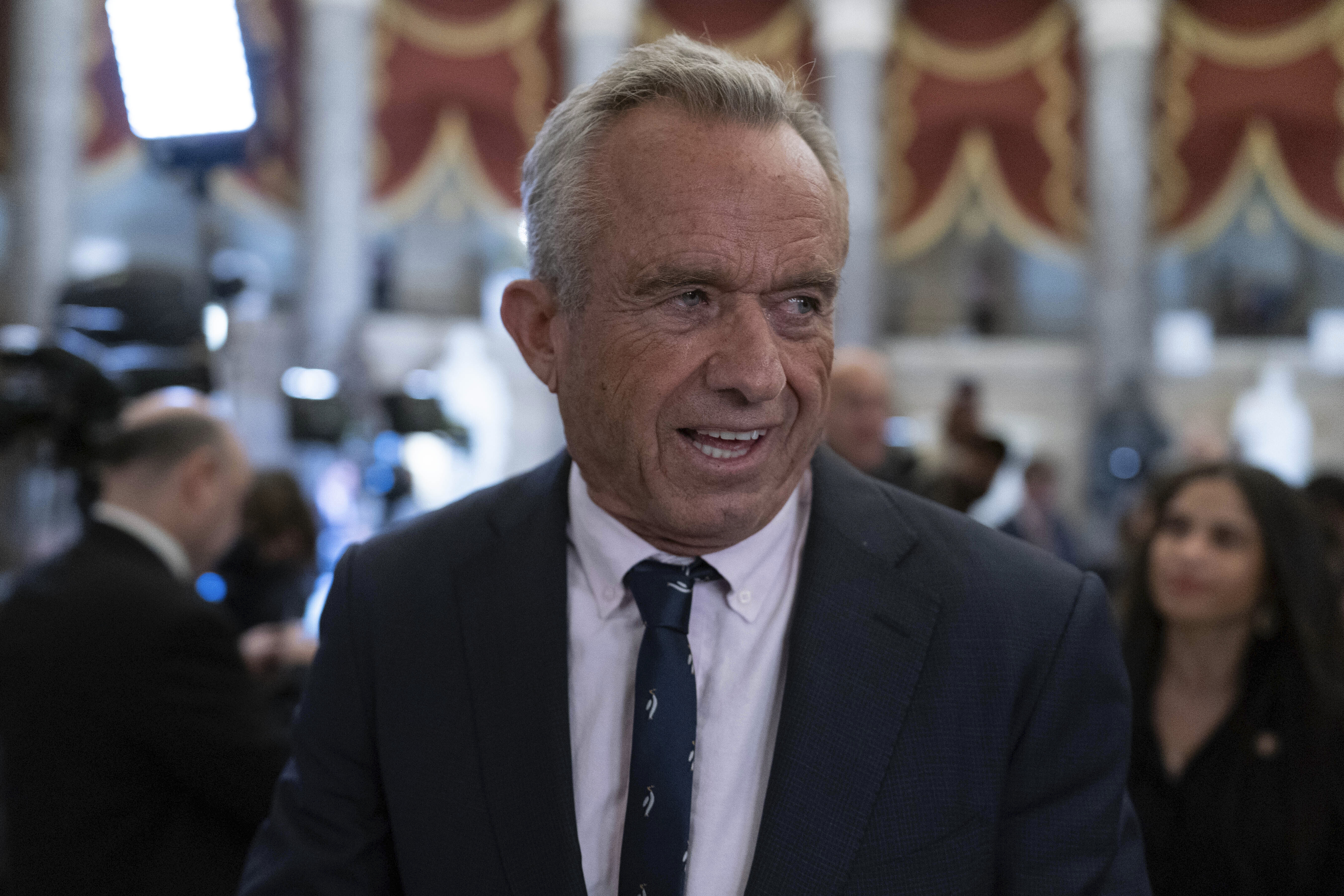 Secretary of Health and Human Services Robert F. Kennedy Jr. walks to the House Chamber before President Donald Trump addresses to a joint session of Congress at the Capitol in Washington, Tuesday, March 4, 2025.