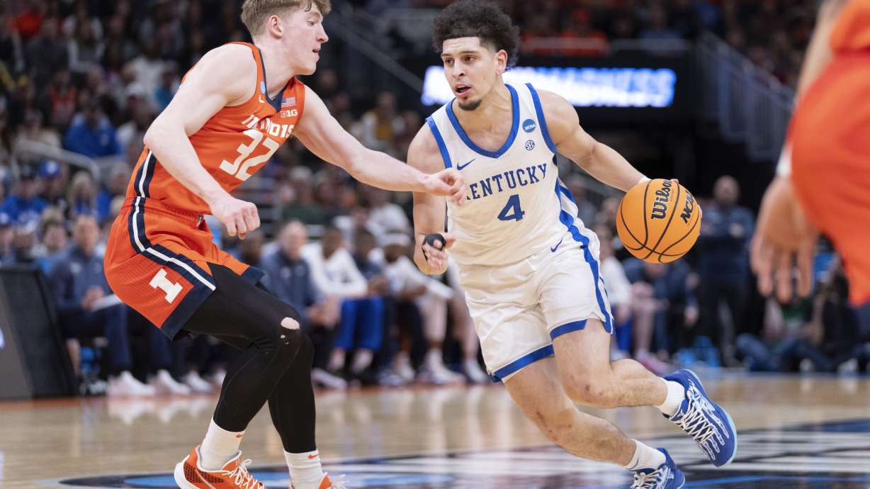Kentucky guard Koby Brea (4) handles the ball against Illinois guard Kasparas Jakucionis (32) during the first half in the second round of the NCAA college basketball tournament, Sunday, March 23, 2025, in Milwaukee.