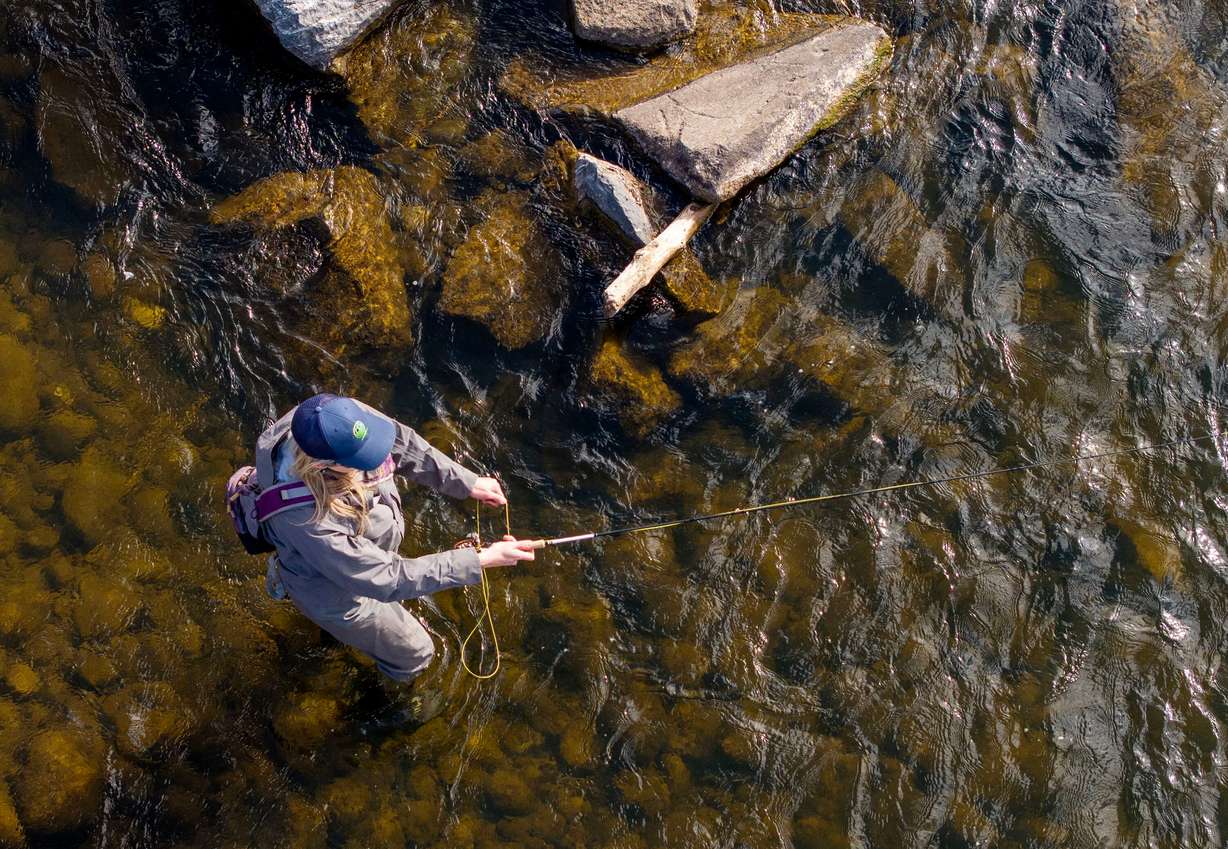 National champion fly caster Audrey Wilson does a little fishing in the Provo River in the Heber Valley on March 12.