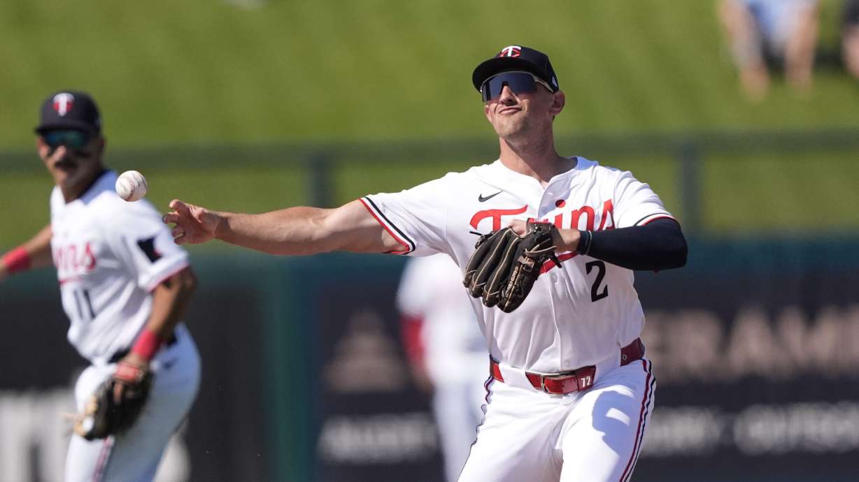 Minnesota Twins shortstop Brooks Lee (2) fields a ground out by Baltimore Orioles Gary Sanchez to end the fifth inning of a spring training baseball game in Fort Myers, Fla., Friday, Feb. 28, 2025.
