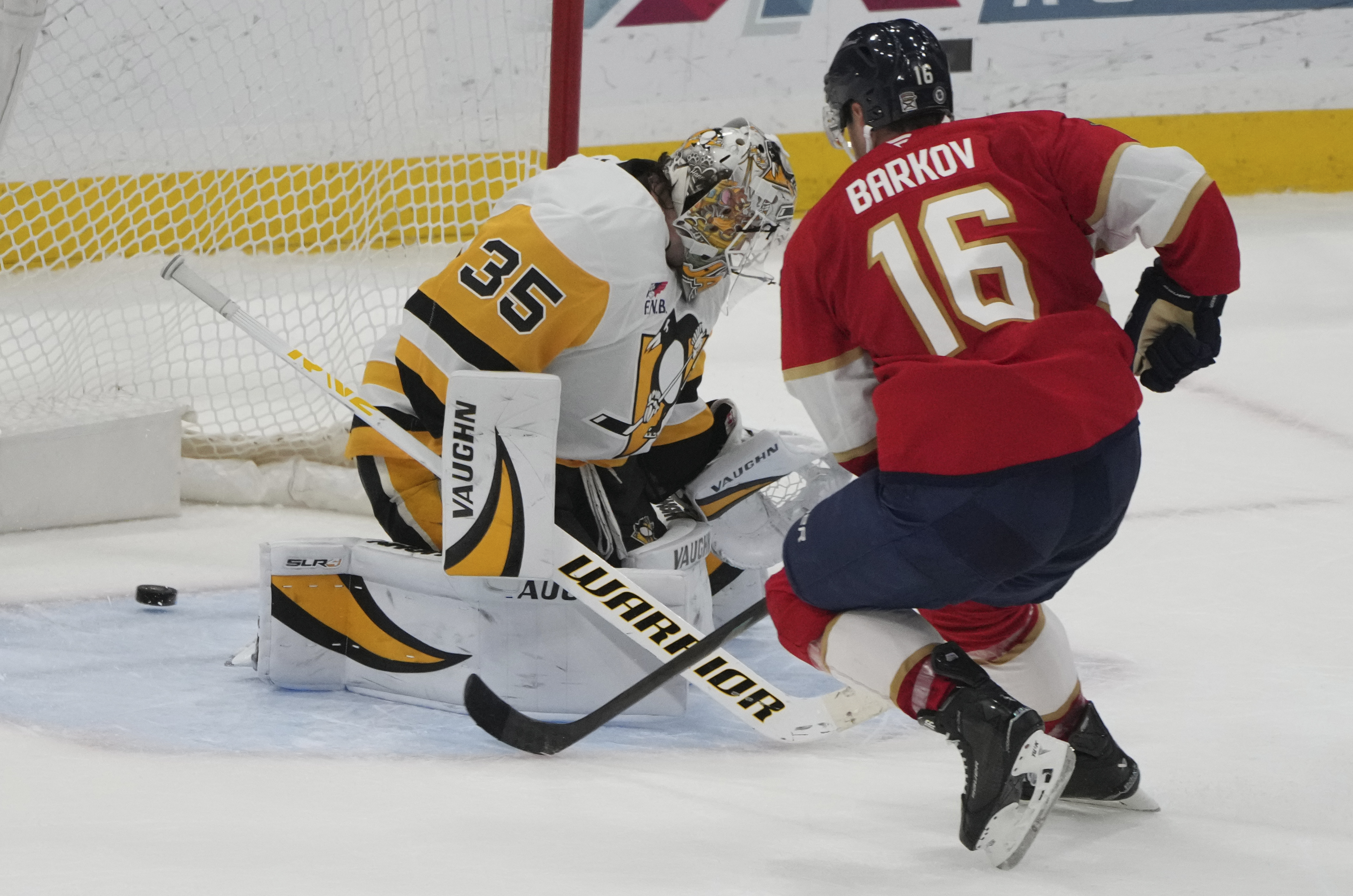 Florida Panthers center Aleksander Barkov (16) scores the game-winning goal against Pittsburgh Penguins goaltender Tristan Jarry (35) during a shootout in an NHL hockey game, Sunday, March 23, 2025, in Sunrise, Fla.