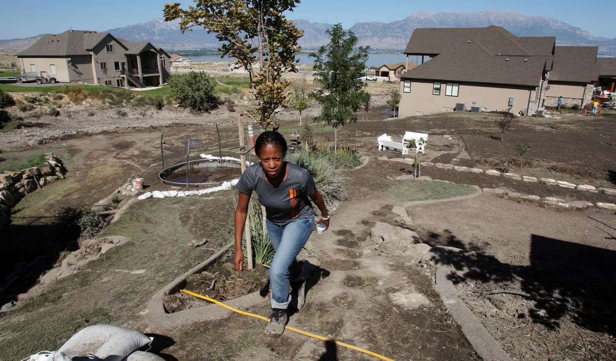 Mayor Mia Love of Saratoga Springs walks in mud-damaged areas of her city as she checks on residents Sept. 4, 2012.