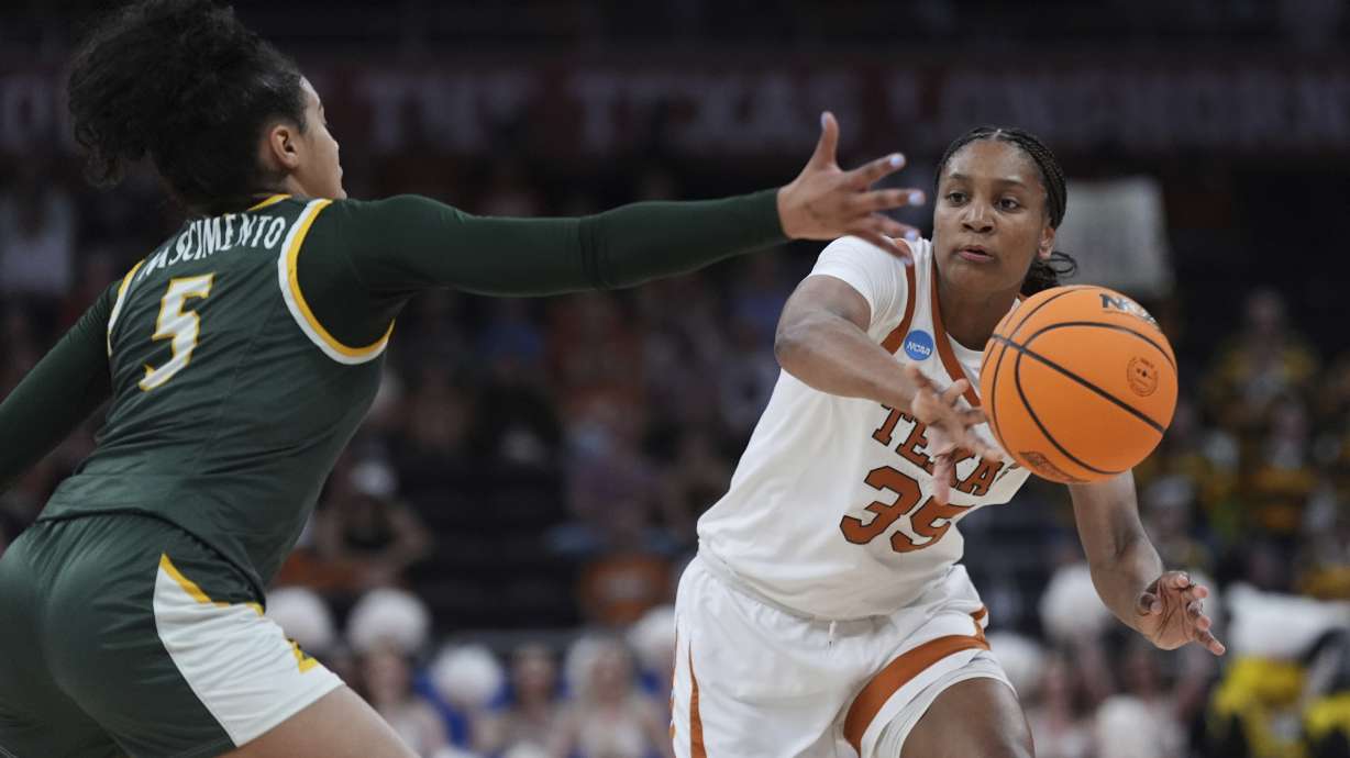 Texas forward Madison Booker (35) passes around William & Mary guard Bella Nascimento (5) during the second half in the first round of the NCAA college basketball tournament in Austin, Texas, Saturday, March 22, 2025.