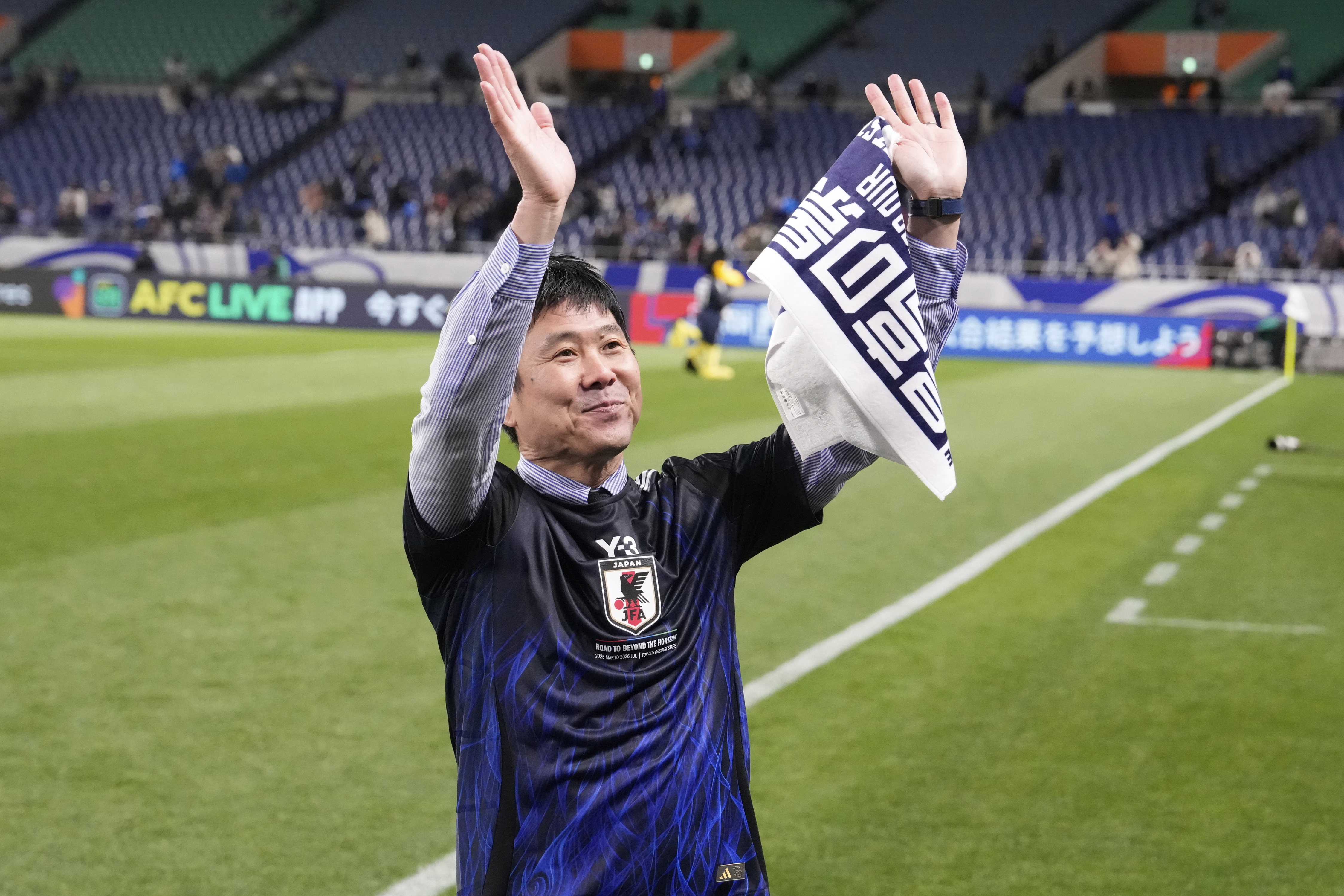 Japan's head coach Hajime Moriyasu acknowledges the applause from the crowd after their win against Bahrain in the World Cup qualifying soccer match at Saitama Stadium in Saitama, Japan, Thursday, March 20, 2025.