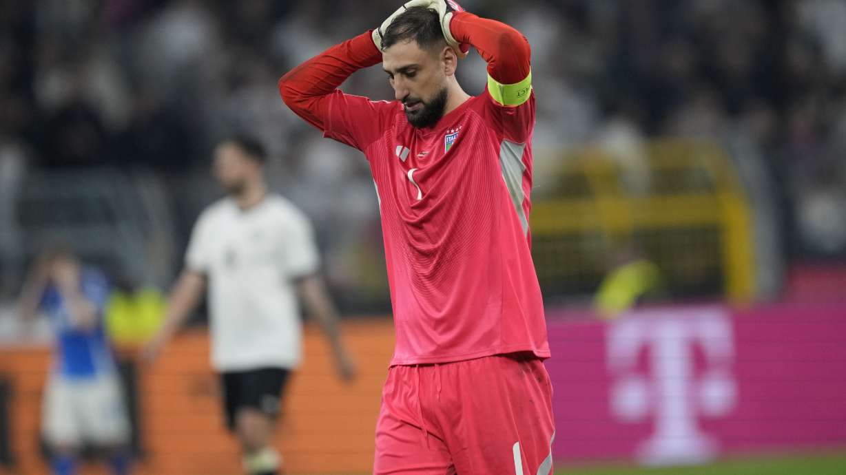 Italy's goalkeeper Gianluigi Donnarumma reacts after the Nations League quarterfinal second leg soccer match between Germany and Italy at the Signal-Iduna Park in Dortmund, Germany, Sunday, March 23, 2025.