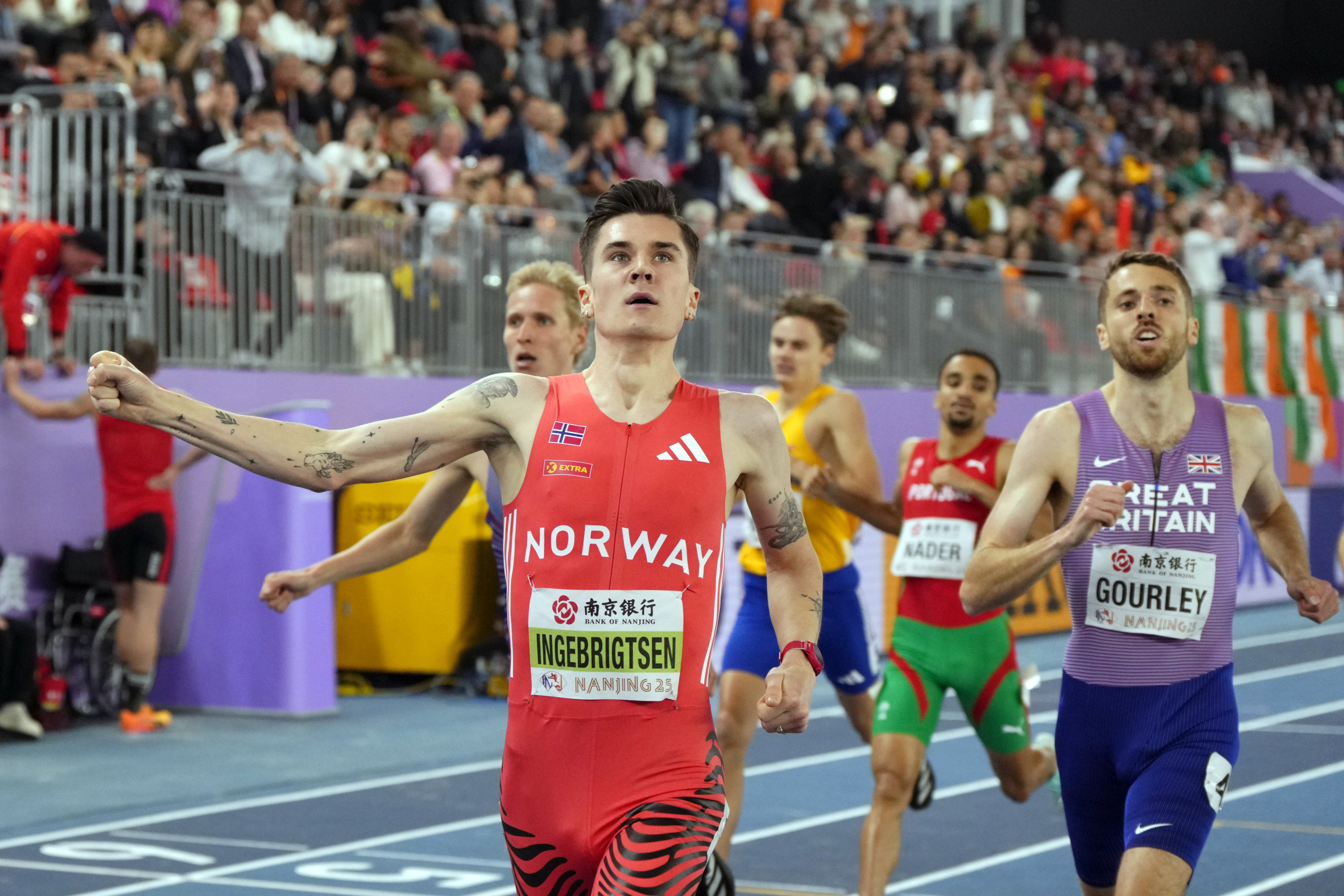 Jakob Ingebrigtsen, of Norway, crosses the finish line to win the men's 1500 meters final at the World Athletics Indoor Championships in Nanjing, China, Sunday, March 23, 2025.