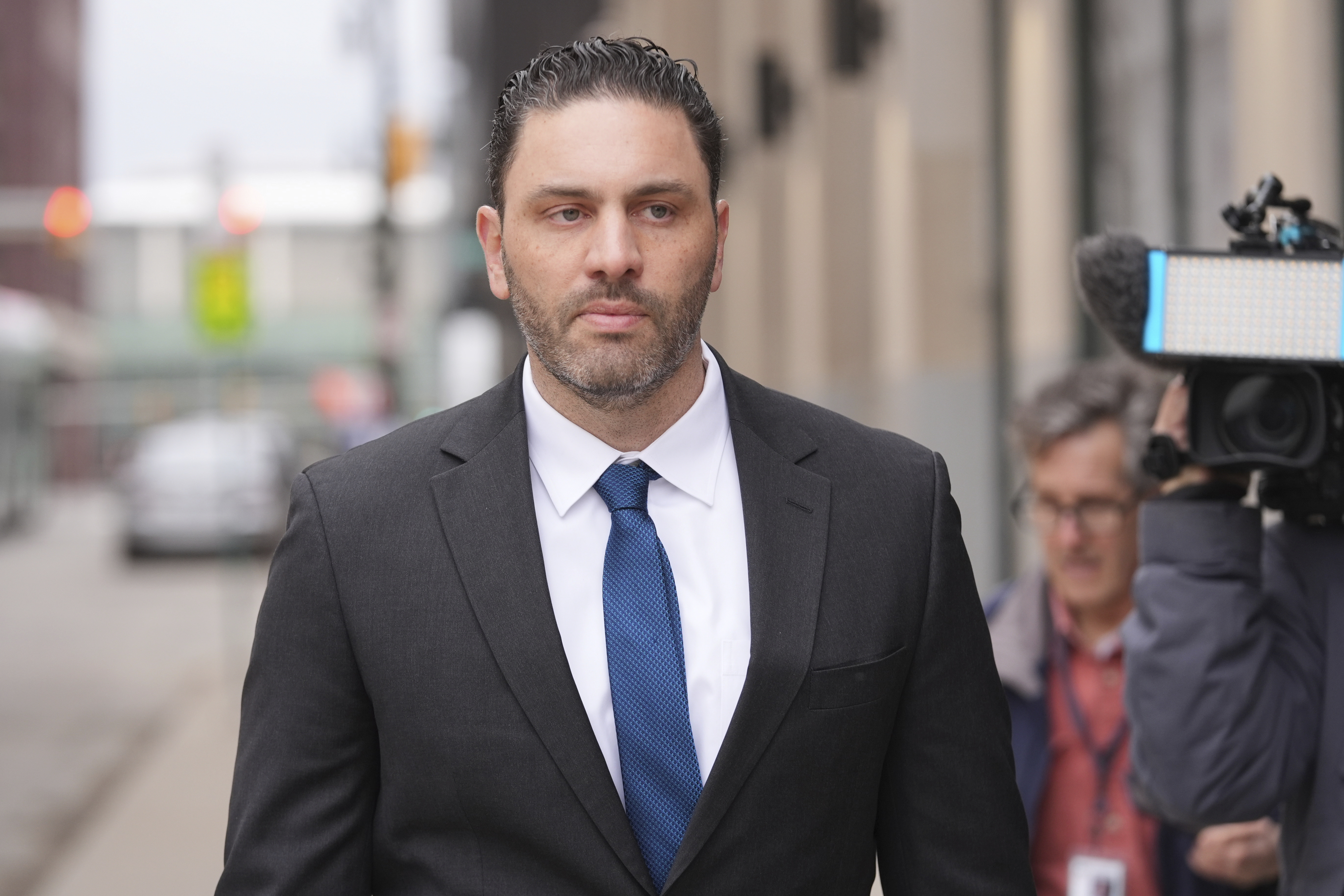 Former NFL and University of Michigan assistant football coach Matt Weiss leaves federal court in Detroit, Monday, March 24, 2025.
