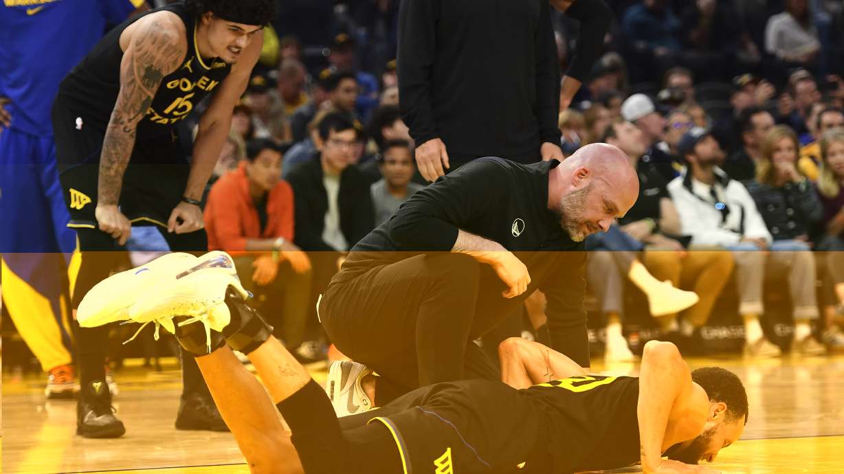 Golden State Warriors' Stephen Curry (30) reacts after landing on his back in a play during the second half of an NBA basketball game against the Golden State Warriors in San Francisco, Thursday, March 20, 2025.