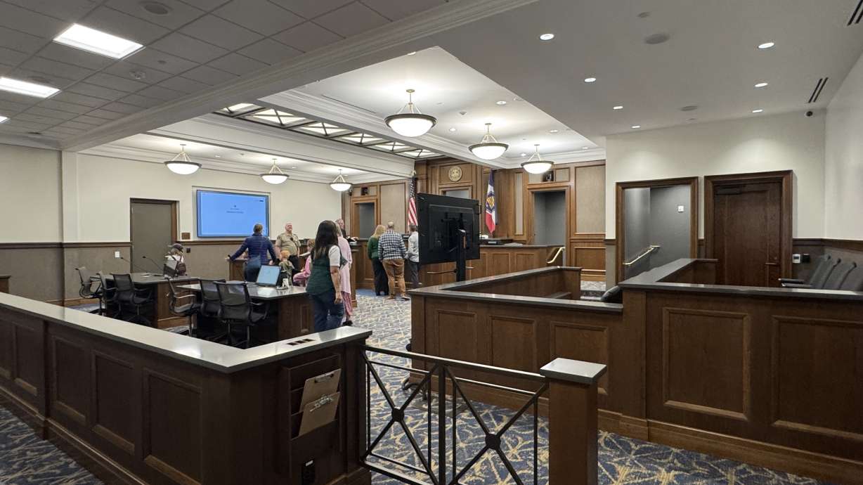 People tour a courtroom at the 6th District Courthouse in Manti. A Colorado woman is facing charges of obstruction accusing her of tampering with witnesses who were scheduled to testify during her son's sex abuse trial in Manti.