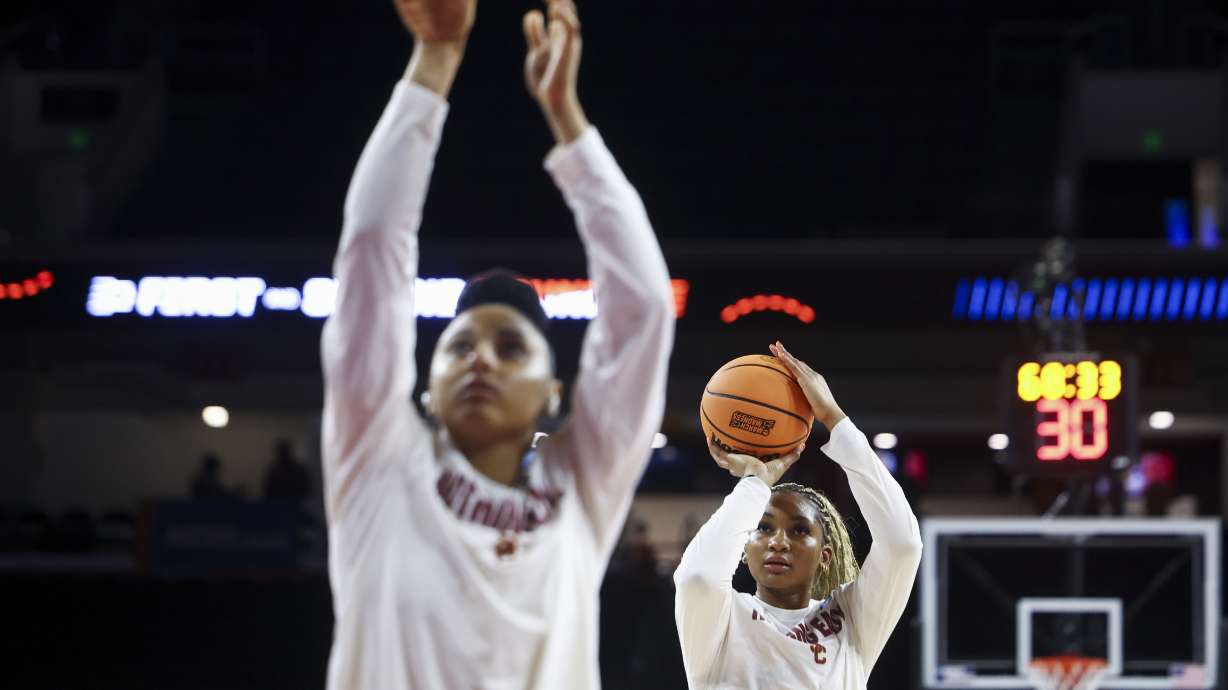 Southern California forward Kiki Iriafen, right, warms up behind guard JuJu Watkins, left, before a game against Mississippi State in the second round of the NCAA college basketball tournament Monday, March 24, 2025, in Los Angeles.