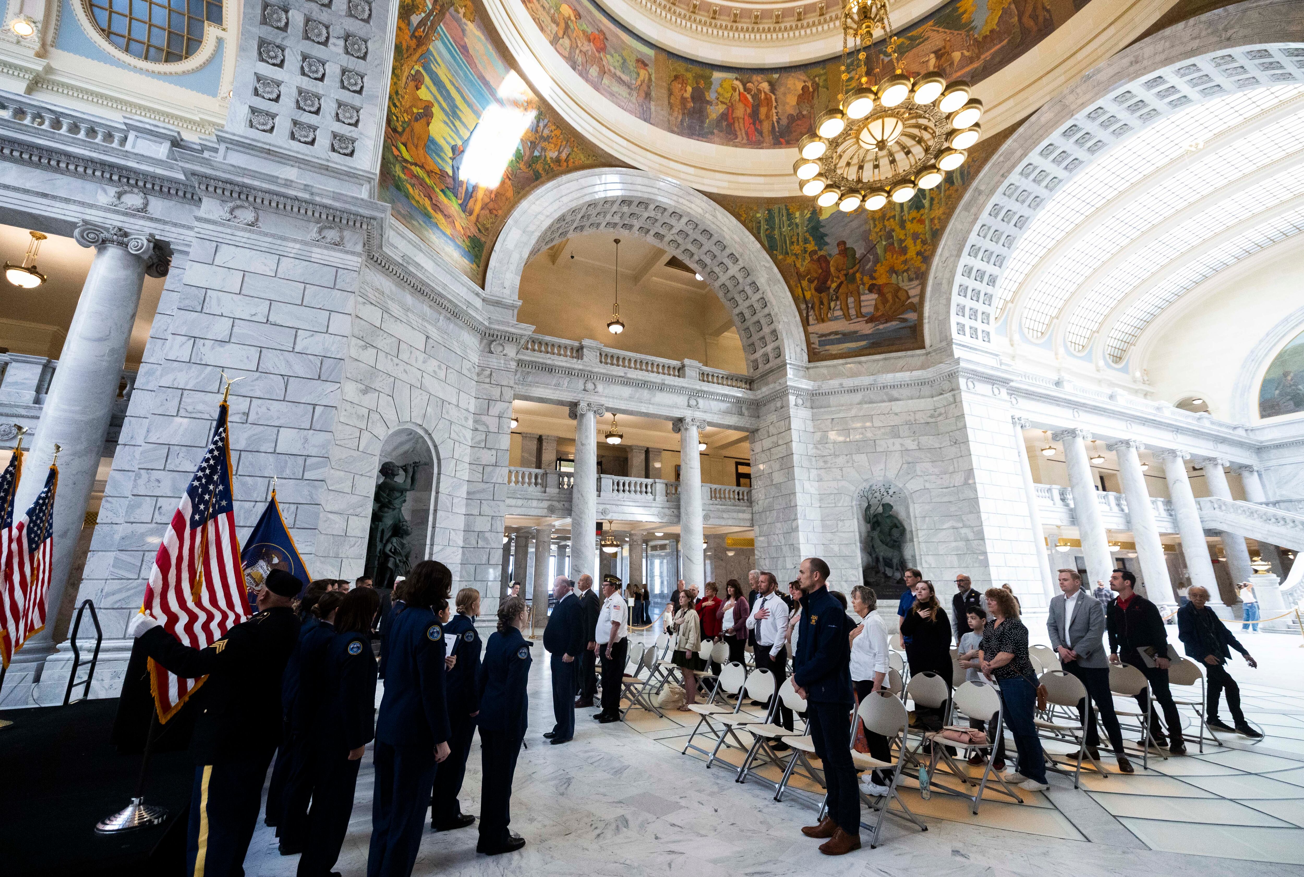 Attendees stand for the national anthem during a tribute to Utah’s five Medal of Honor recipients on National Medal of Honor Day, where an effort was announced to preserve their legacy through a statewide sculpture initiative, at the Capitol in Salt Lake City on Tuesday.