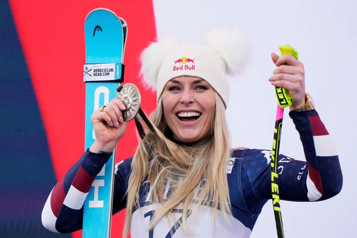 Second place finisher United States' Lindsey Vonn celebrates during a medal ceremony for the women's super-G at the World Cup Finals skis during a men's super-G run at the World Cup Finals, Sunday in Sun Valley, Idaho.