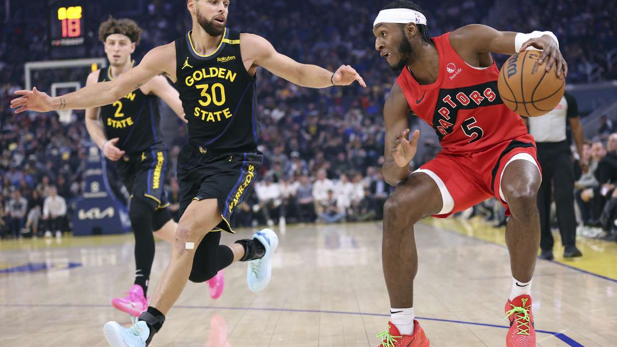 Golden State Warriors' Stephen Curry defends against Toronto Raptors' Immanuel Quickly in 1st quarter during NBA game at Chase Center in San Francisco on Thursday, March 20, 2025.