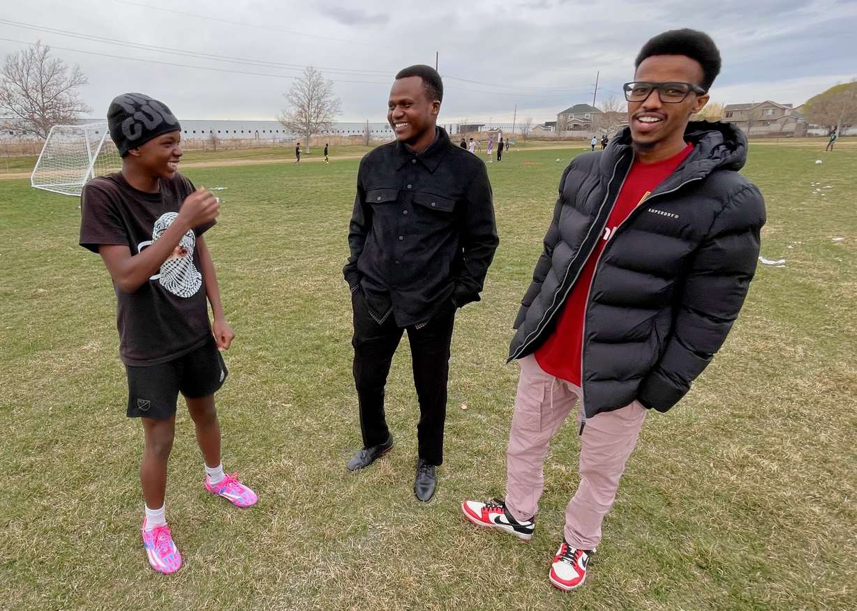 Future FC soccer team organizers Abdi Iftin, center, and Abdi Gedi, right, with player Abdi Shire at a practice at Westpointe Park in Salt Lake City on March 21.
