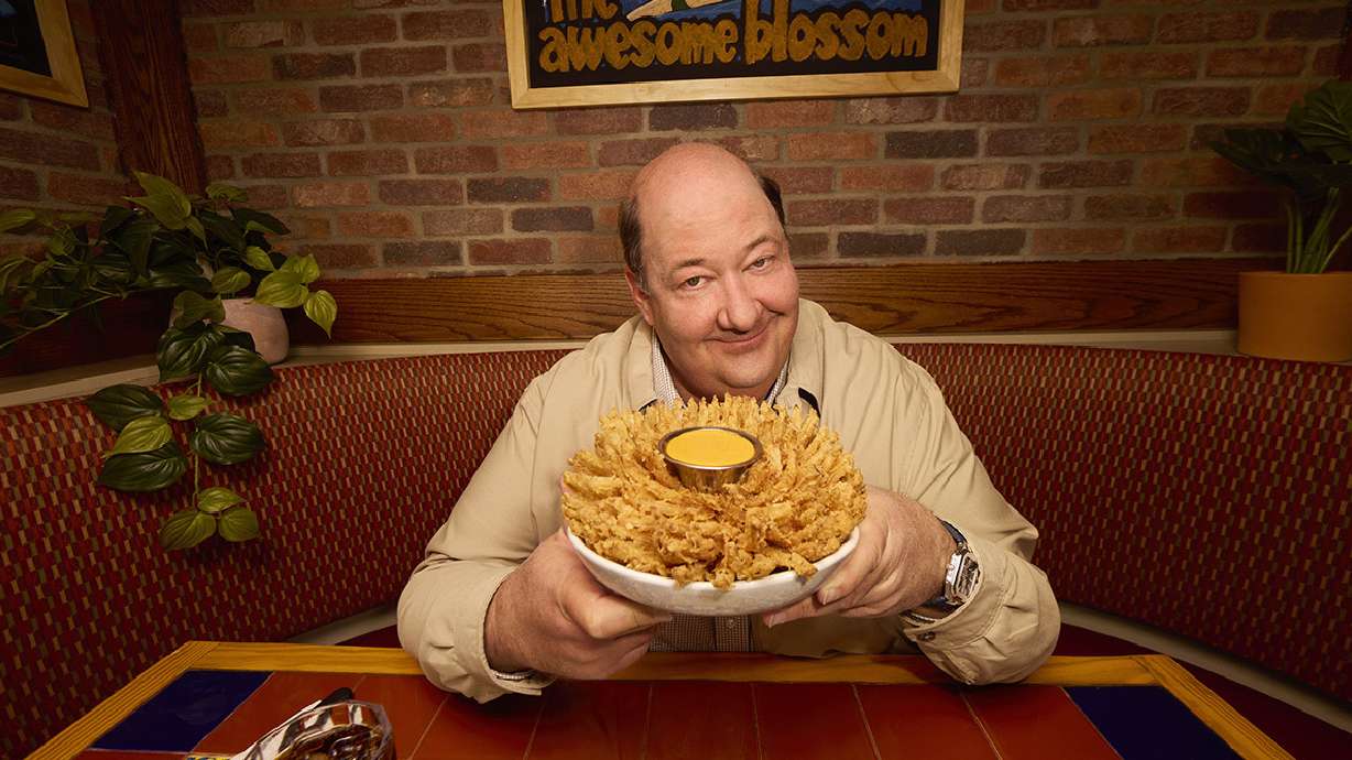 Actor Brian Baumgartner, who played Kevin Malone in the TV series "The Office," posing with an "awesome blossom" at a soon-to-be opened Chili's in Dickson City, Pa.