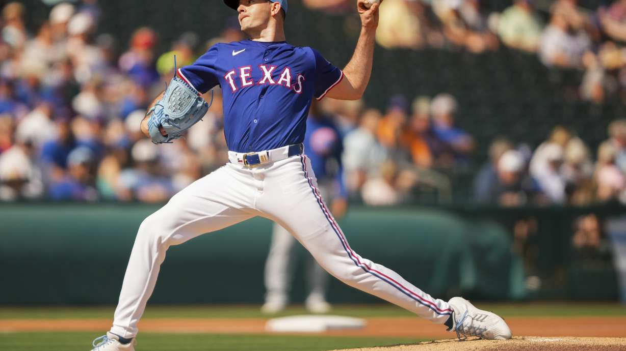 Texas Rangers starting pitcher Cody Bradford throws against the Chicago Cubs during the first inning of a spring training baseball game Friday, Feb. 28, 2025, in Surprise, Ariz.
