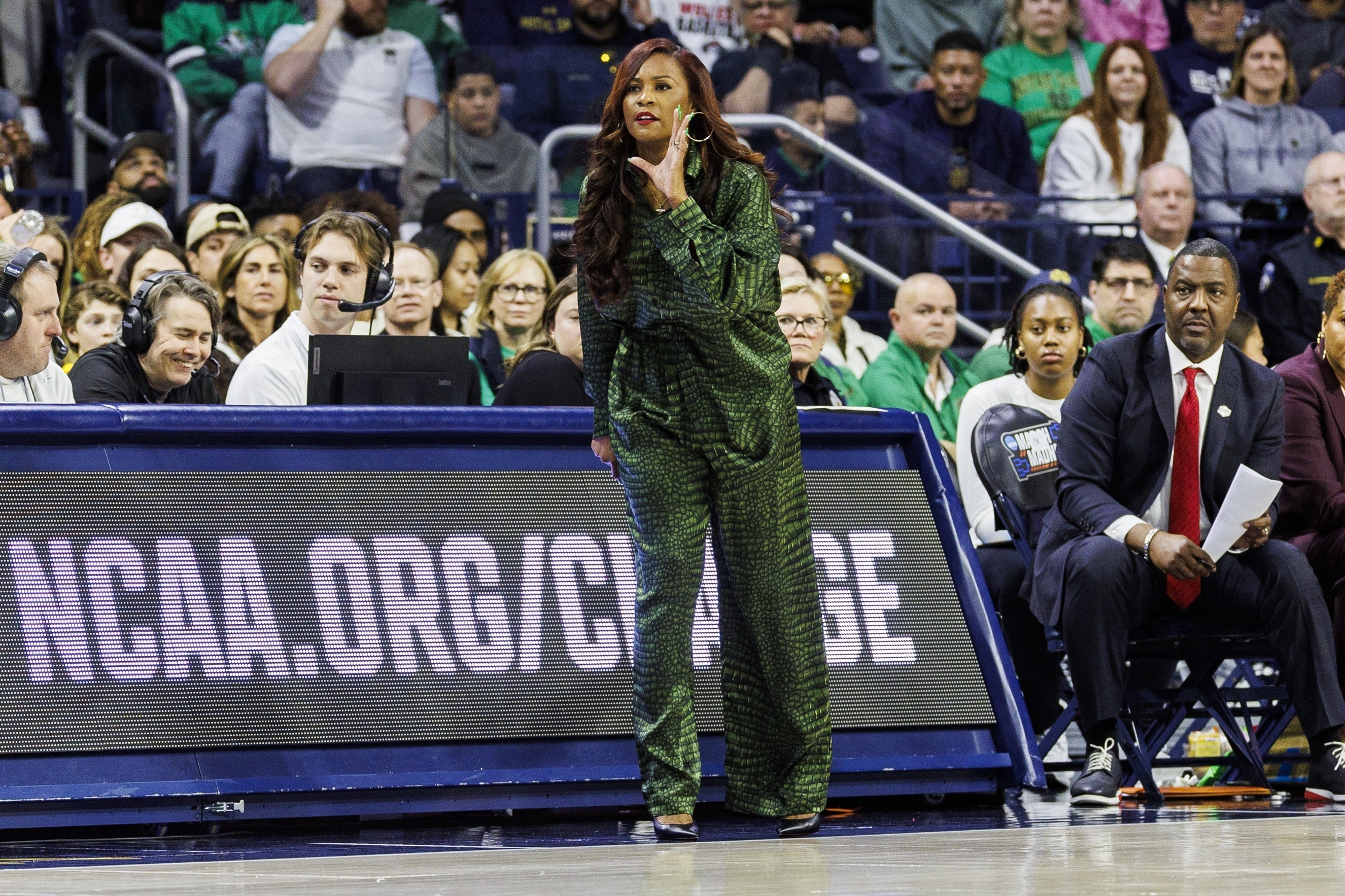 Notre Dame head coach Niele Ivey, center, shouts instructions during the first half against Michigan in the second round of the NCAA college basketball tournament Sunday, March 23, 2025, in South Bend, Ind.