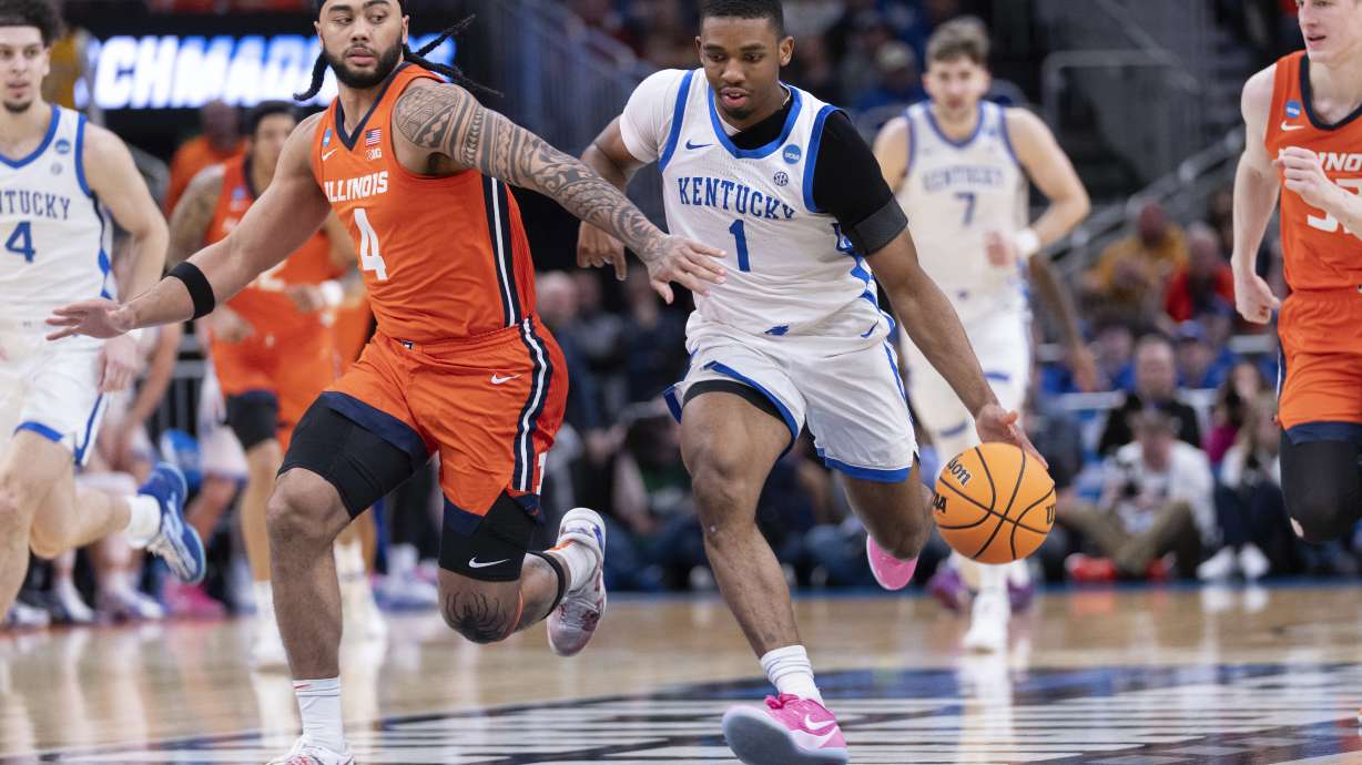 Kentucky guard Lamont Butler (1) handles the ball against Illinois guard Kylan Boswell (4) during the first half in the second round of the NCAA college basketball tournament, Sunday, March 23, 2025, in Milwaukee.