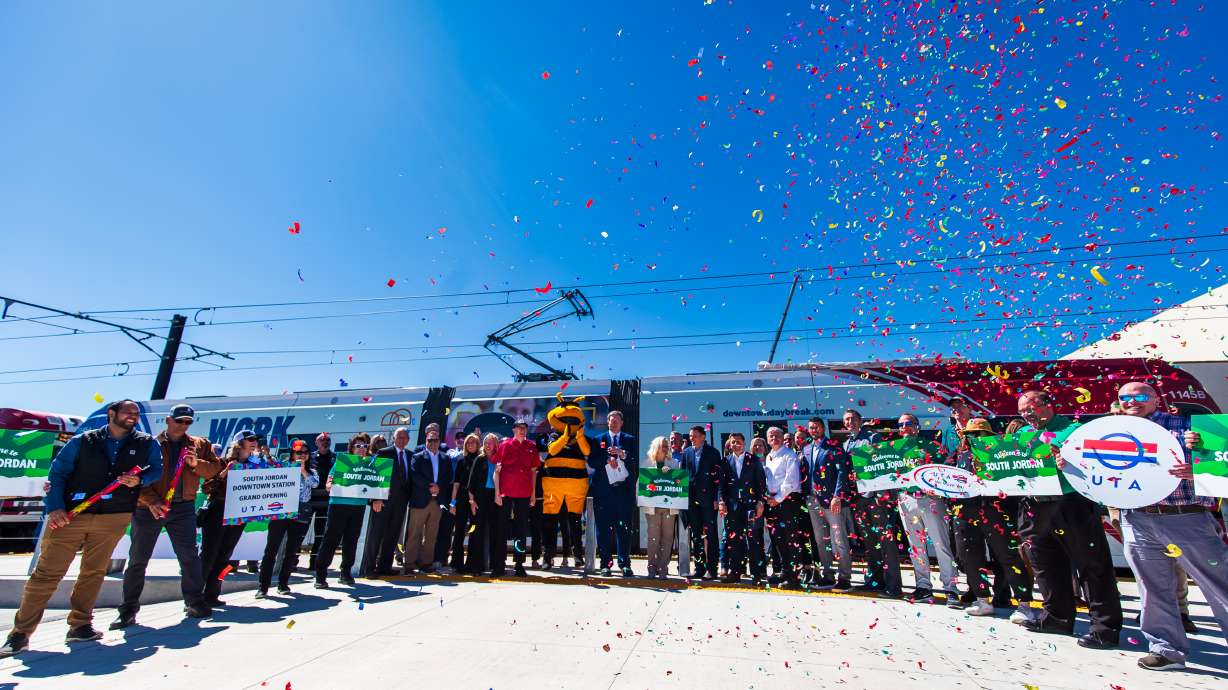 Salt Lake Bees mascot Bumble joins representatives of UTA, South Jordan, and Larry H. Miller Company in celebrating the opening of the South Jordan Downtown Station in South Jordan on Wednesday. The station opened a bit ahead of schedule.