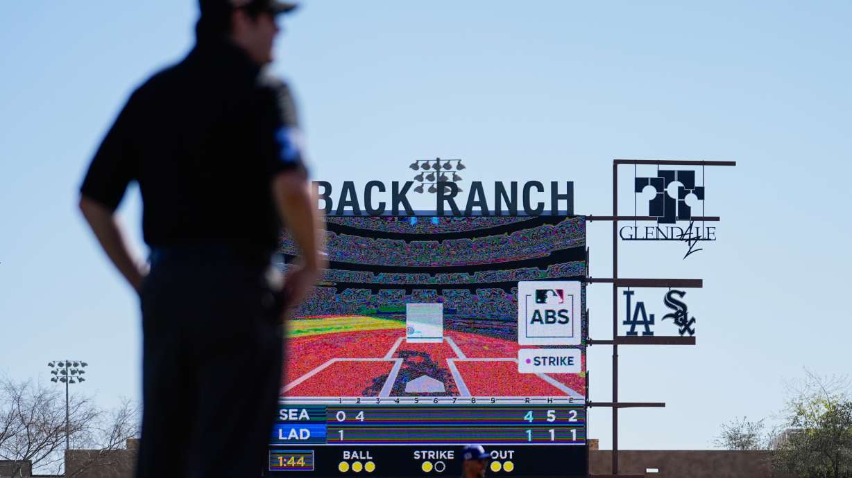 FILE - A replay from the Automated Ball-Strike System plays after a play was challenged is displayed on the scoreboard during the second inning of a spring training baseball game between the Seattle Mariners and the Los Angeles Dodgers, Tuesday, Feb. 25, 2025, in Phoenix.