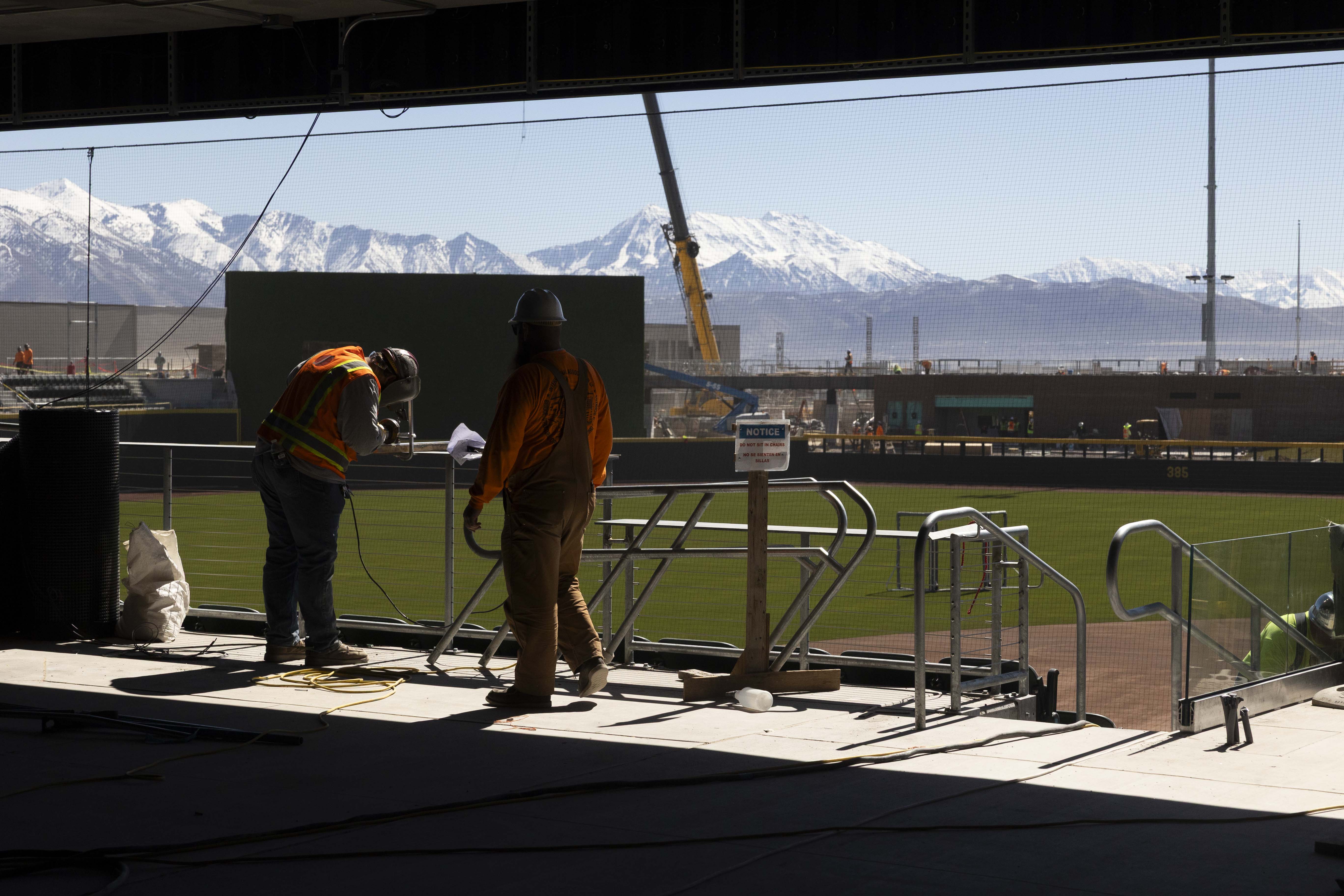 Construction workers work on the Salt Lake Bees' new baseball stadium, The Ballpark at American First Square, in South Jordan on Wednesday.