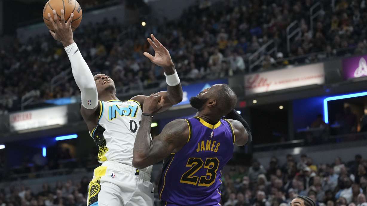Indiana Pacers guard Bennedict Mathurin (00) shoots over Los Angeles Lakers forward LeBron James (23) during the second half of an NBA basketball game in Indianapolis, Wednesday, March 26, 2025.