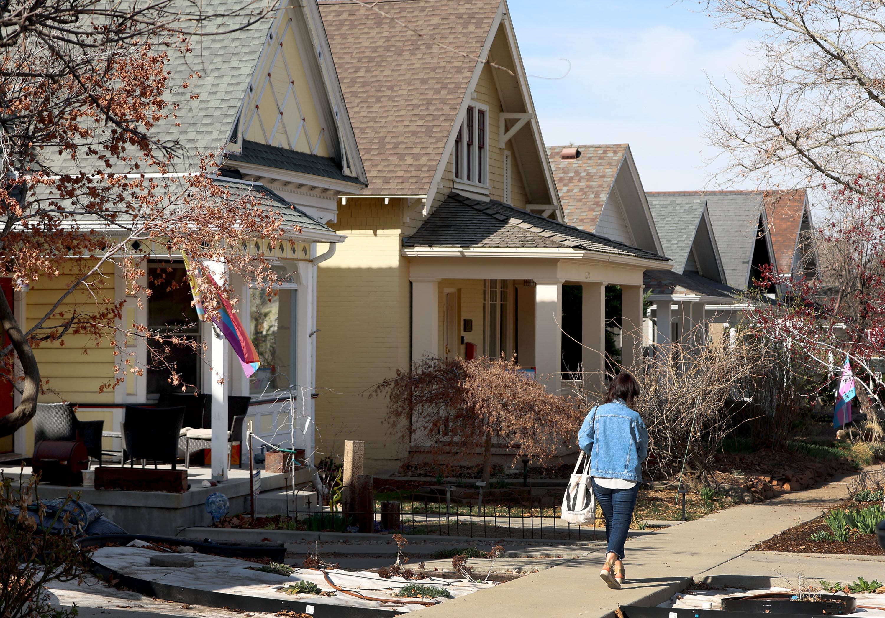 A woman walks down 3rd Avenue in Salt Lake City on Thursday.