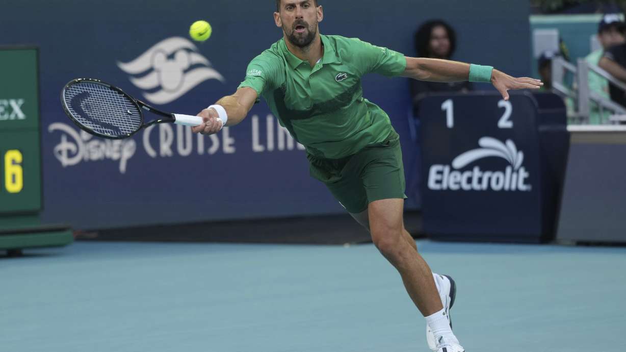 Novak Djokovic of Serbia hits a return to Sebastian Korda during the Miami Open tennis tournament, Thursday, March 27, 2025, in Miami Gardens, Fla.