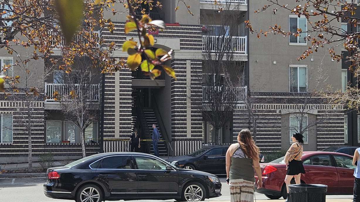 Investigators respond to a police shooting at a Murray apartment March 27. The man who was shot is accused of barricading himself in the apartment and using a homemade flamethrower against police. Charges were filed against him Thursday.