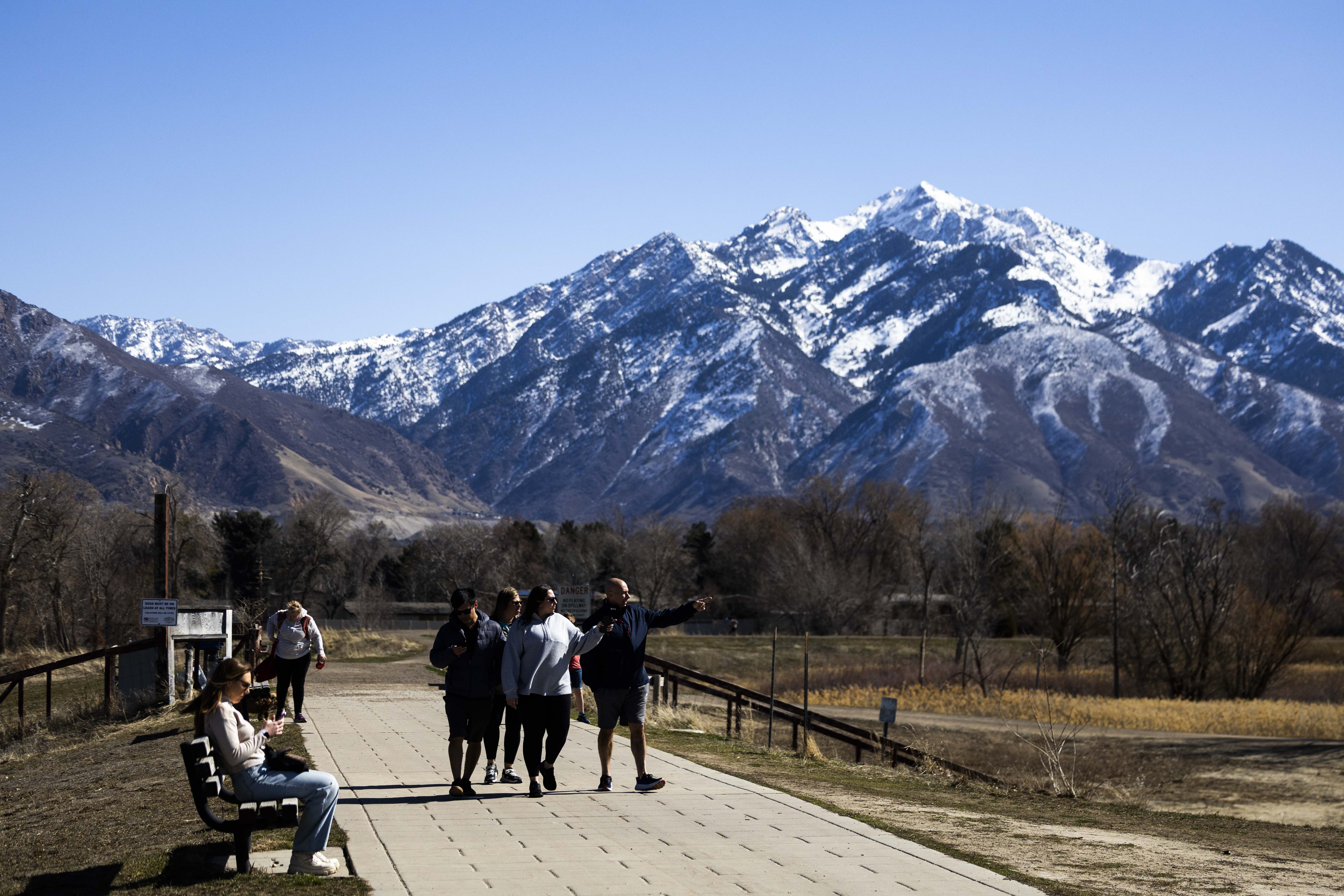 People enjoy the warm weather and sunshine at Wheeler Historic Farm in Murray on March 2. Another run of warm weather this week will give way to cooler temperatures beginning on Friday before valley rain and mountain snow over the weekend.
