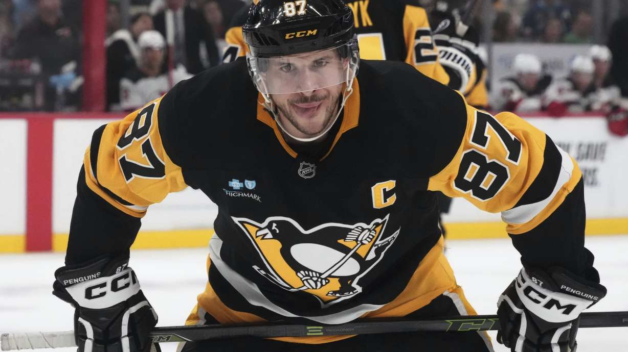 Pittsburgh Penguins' Sidney Crosby prepares to take a face-off during the second period of an NHL hockey game against the New Jersey Devils in Pittsburgh, Saturday, March 15, 2025.