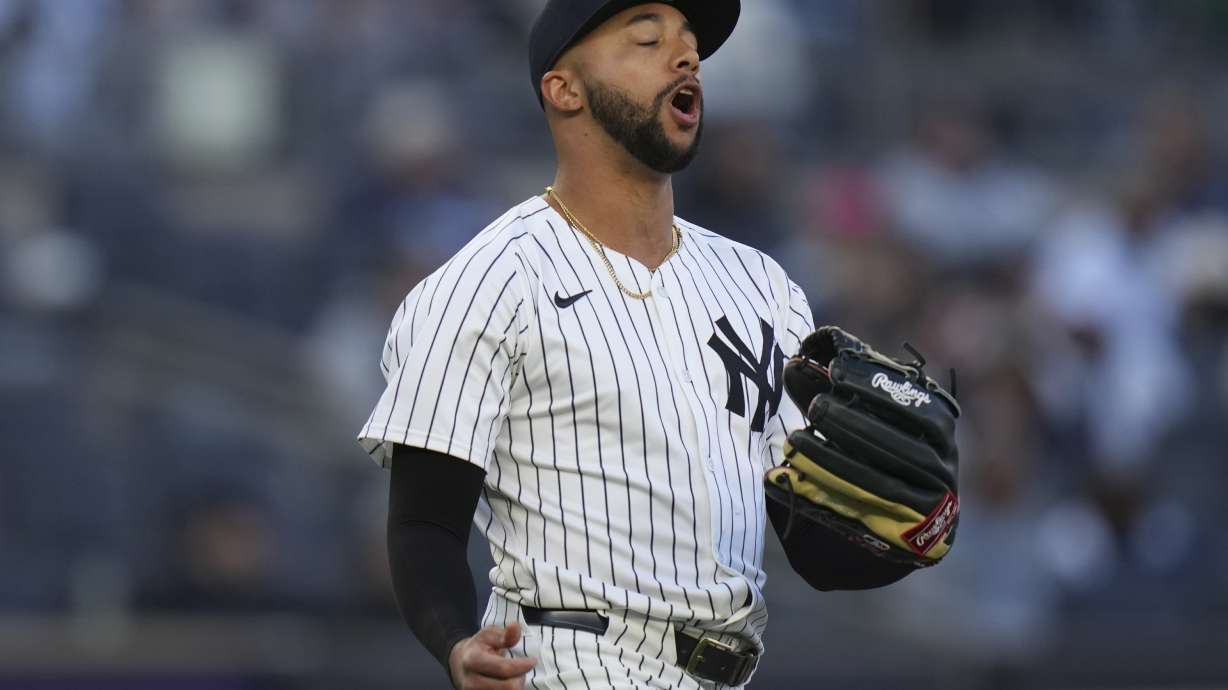 New York Yankees pitcher Devin Williams reacts during the ninth inning of a baseball game against the Milwaukee Brewers at Yankee Stadium, Thursday, March 27, 2025, in New York.